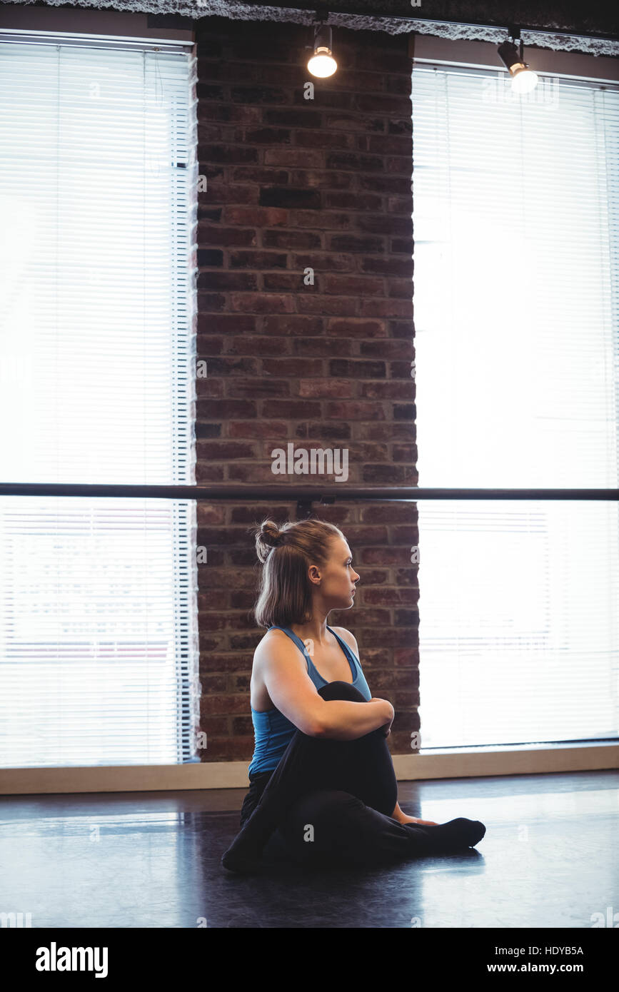 Woman performing stretching exercise in dance studio Stock Photo Alamy