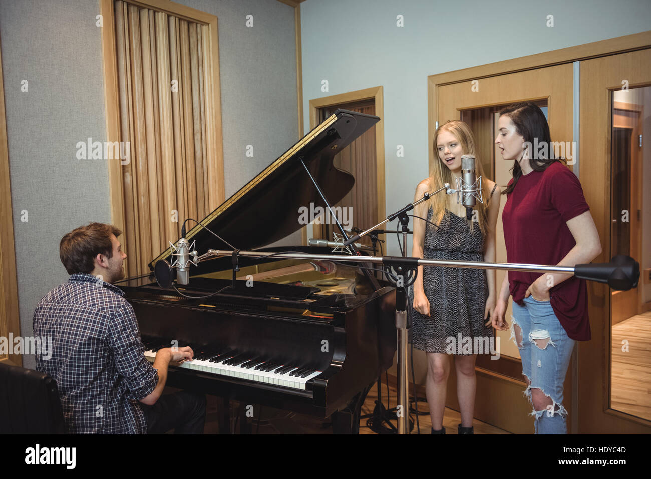 Musician recording a song in music studio Stock Photo Alamy
