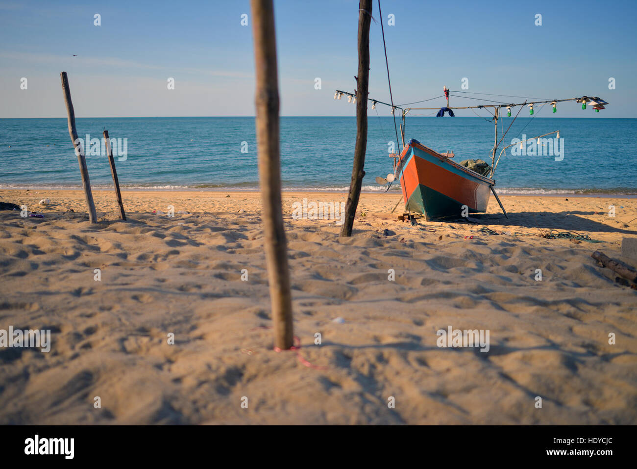 Local fishing boat on a shoreline of Narathiwat province in the south of Thailand Stock Photo