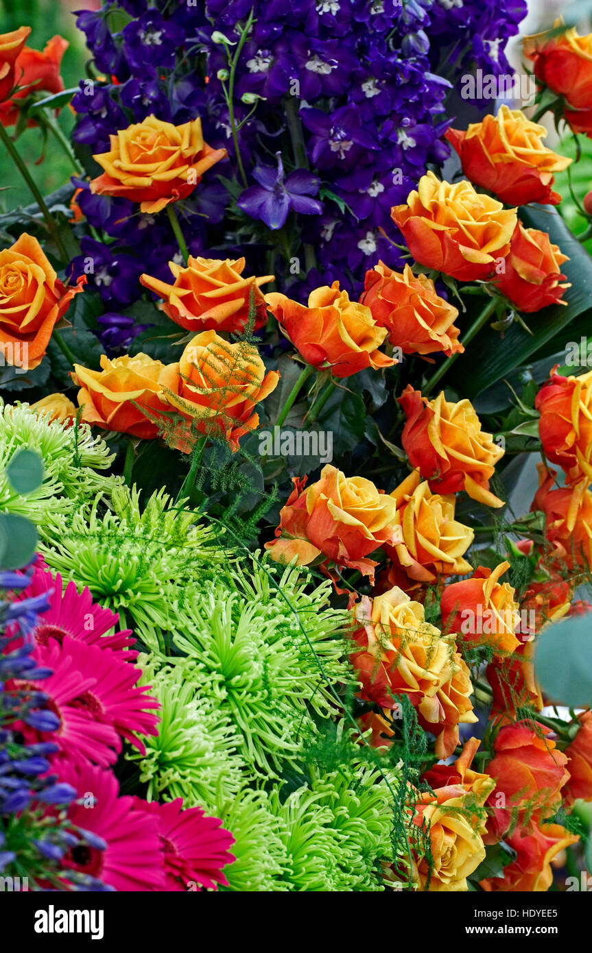 Floral arrangement with roses, delphiniums and chrysanthemums Stock Photo
