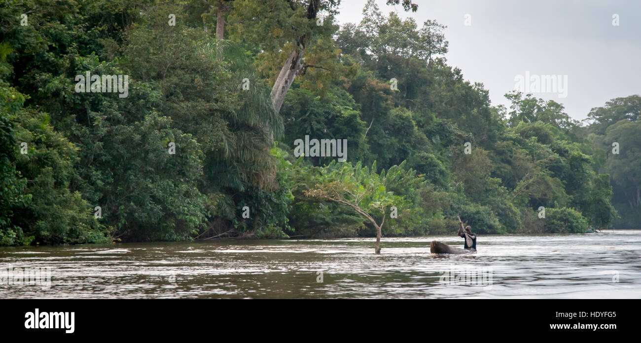 Fisherman in canoe on Moa River, Sierra Leone Stock Photo