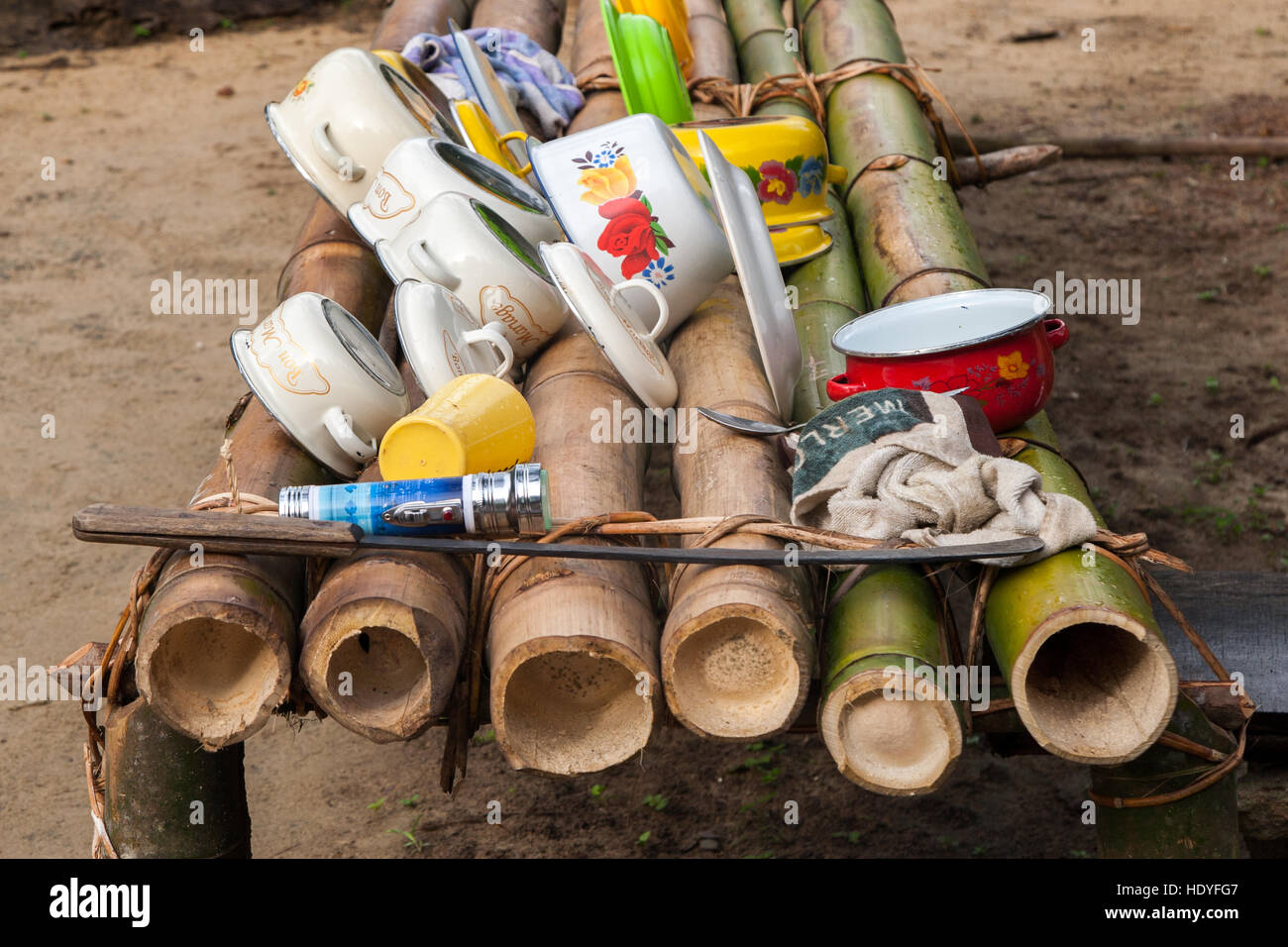 Jungle dish drying rack. Dishes dry on a bamboo rack at a camp on Tiwai Island, Sierra Leone Stock Photo