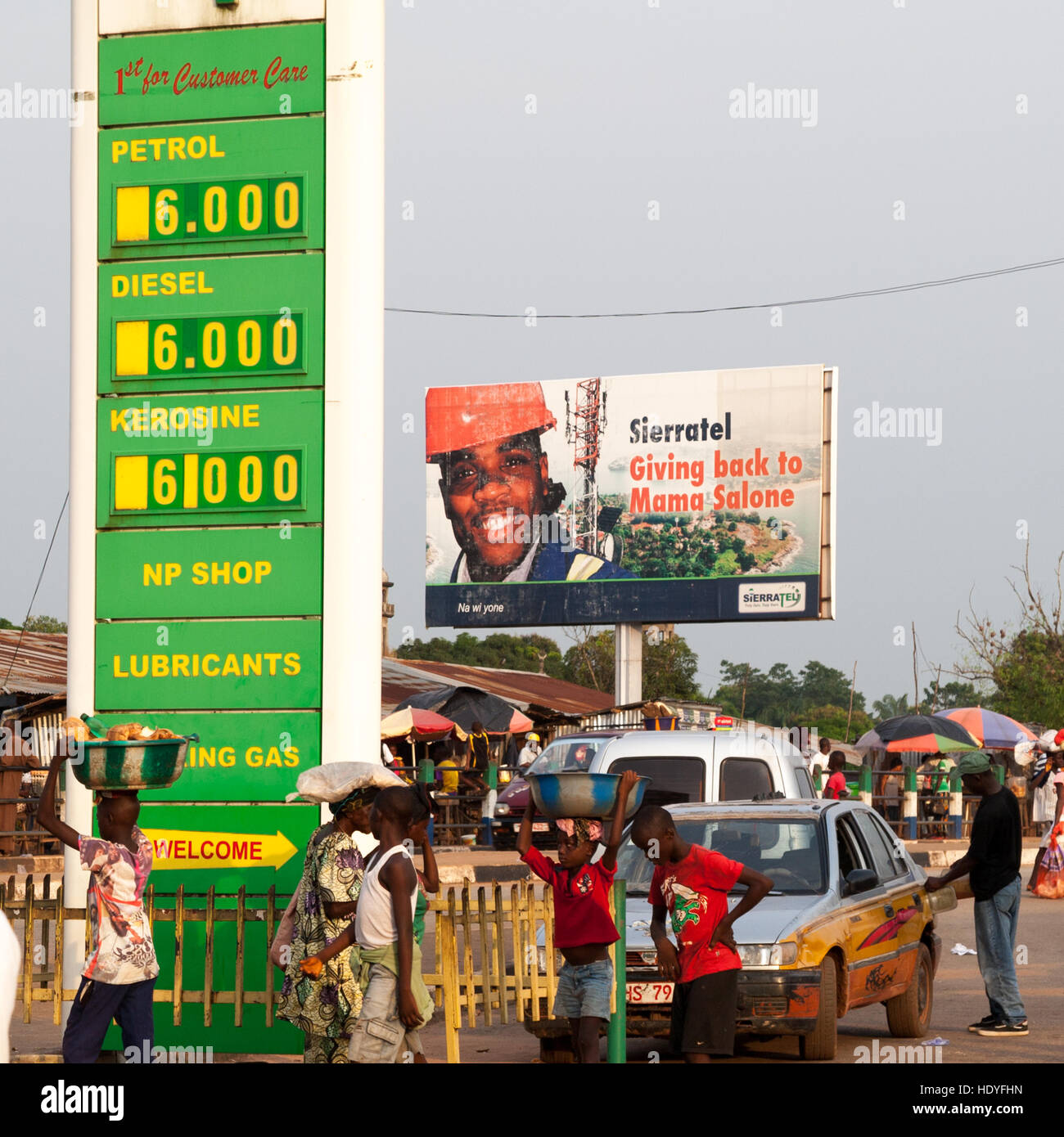 African gas station with people selling snacks Stock Photo