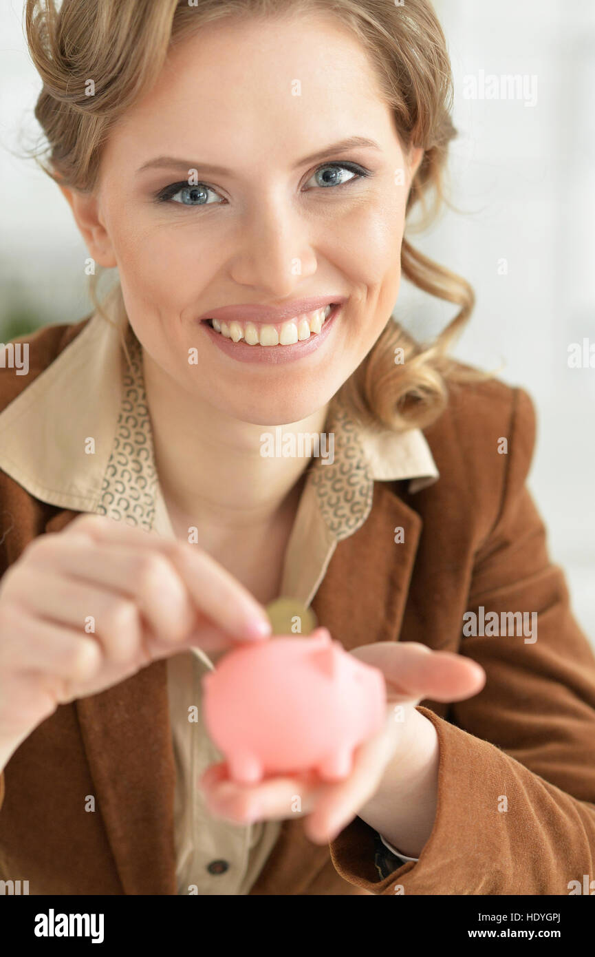 Woman with piggy bank Stock Photo - Alamy