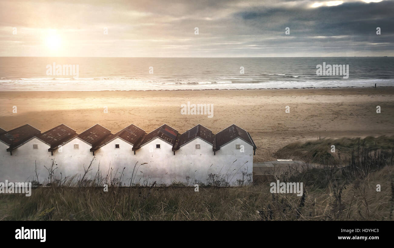 calming image of beach cabins by the sea Stock Photo