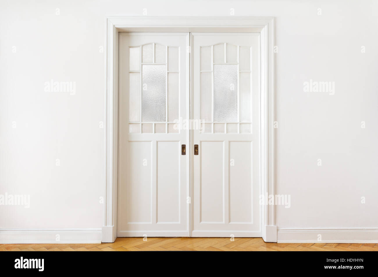 White Wall With An Old Double Sliding Door With Textured