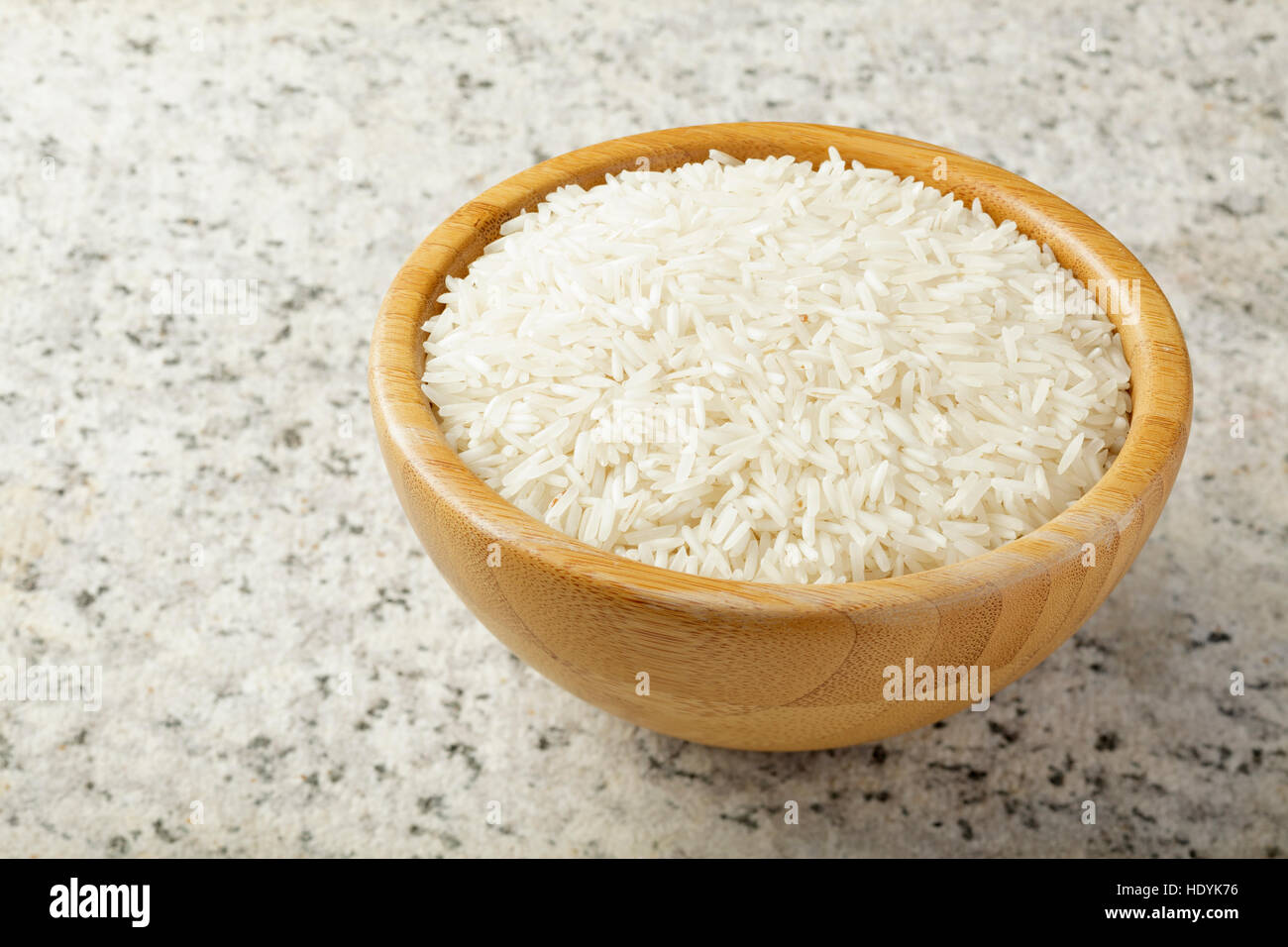White rice in a wooden bowl Stock Photo