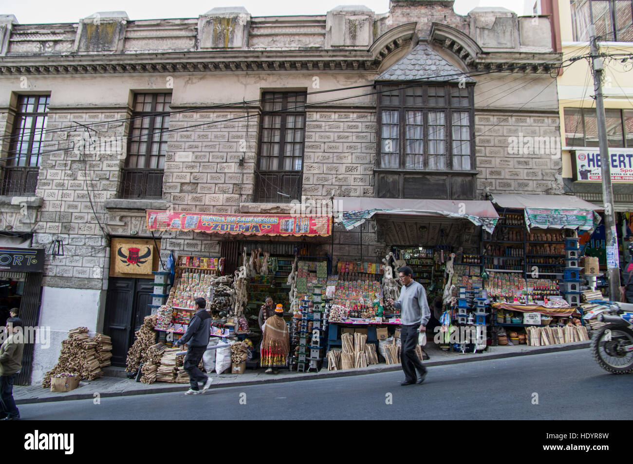 Street in La Paz, Bolivia, a shop sells dried llama foetuses, wood and other items to prepare offerings to the pachamama Stock Photo