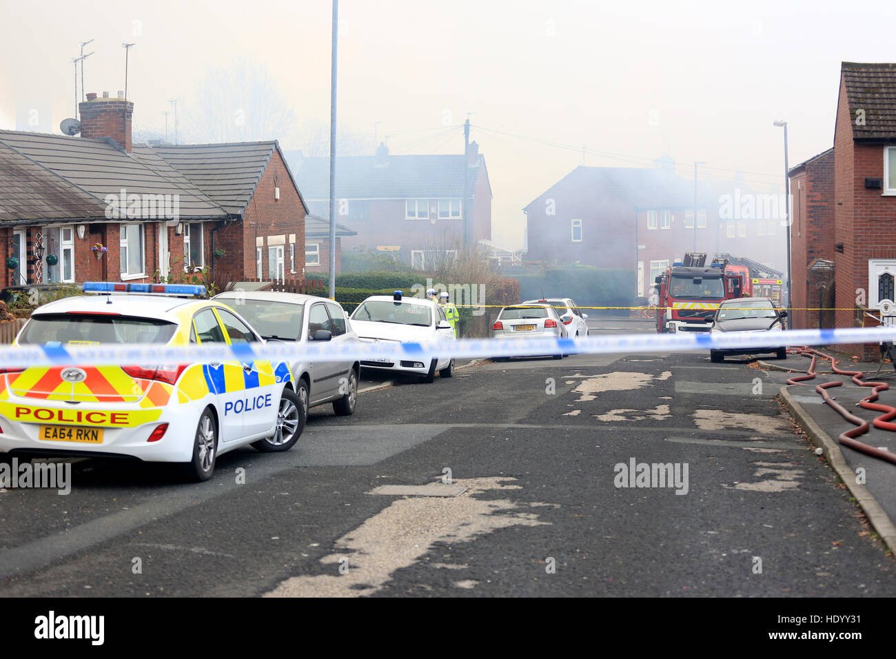 Oldham, UK. 15th Dec, 2016. Police cars on a closed road leading to