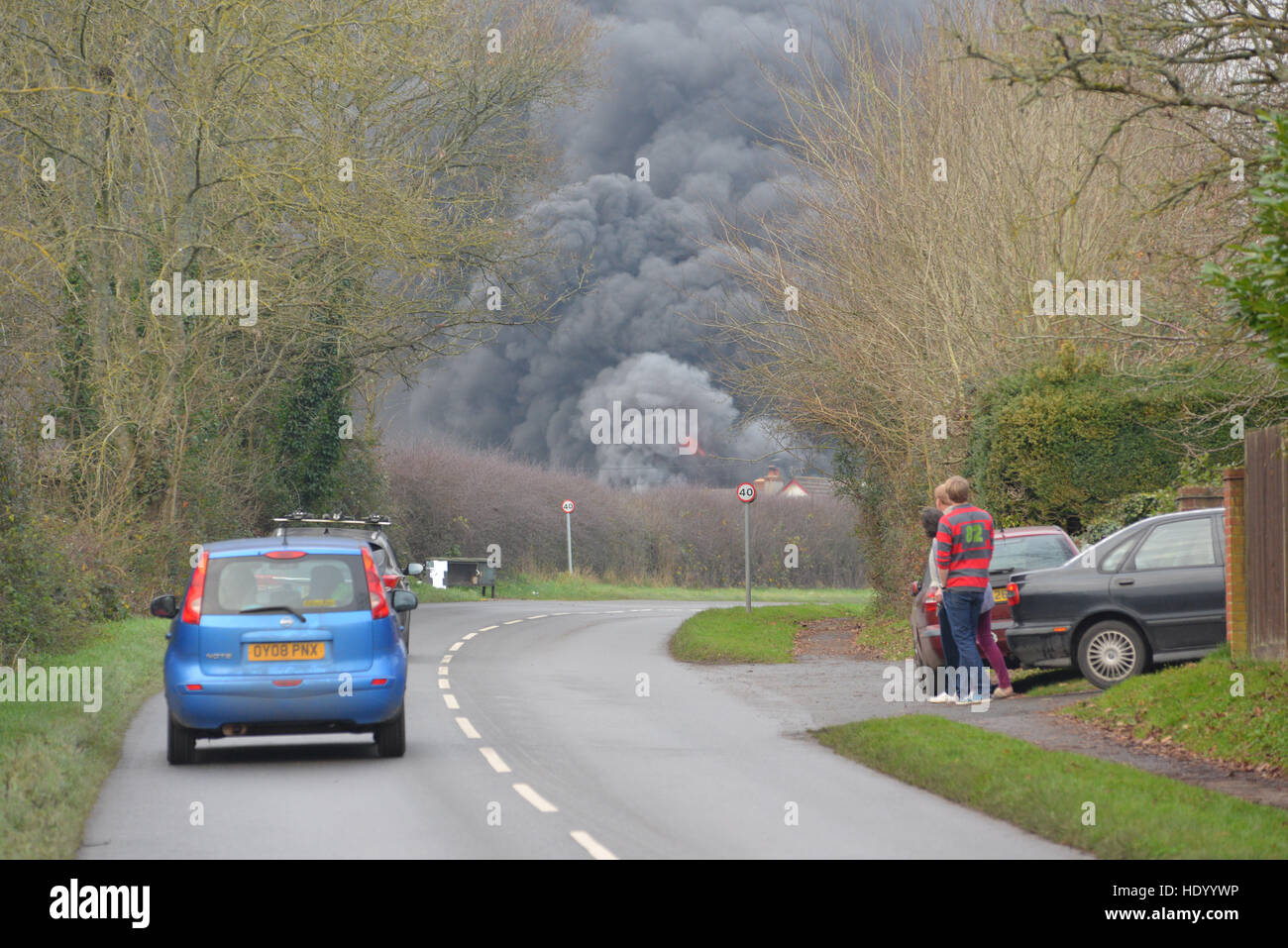 Fordingbridge, Hampshire, UK. 15th December, 2016. Garage fire with plumes of thick black smoke. The fire brigade are in attendance. Stock Photo