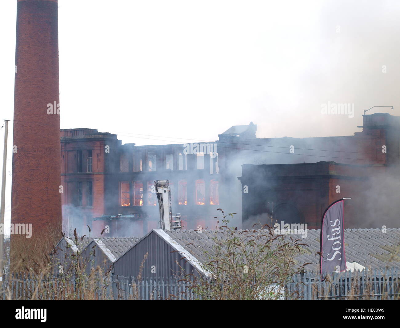 Oldham, UK. 15th Dec, 2016. Emergency services have evacuated more than 100 nearby properties after a large blaze broke out at a paper mill site in Greater Manchester. More than 70 firefighters and 15 fire engines from Greater Manchester Fire and Rescue Service are tackling the fire at the building on Cardwell Street in Oldham, north-east of Manchester, on Thursday morning. © M Kyle/Alamy Live News Stock Photo
