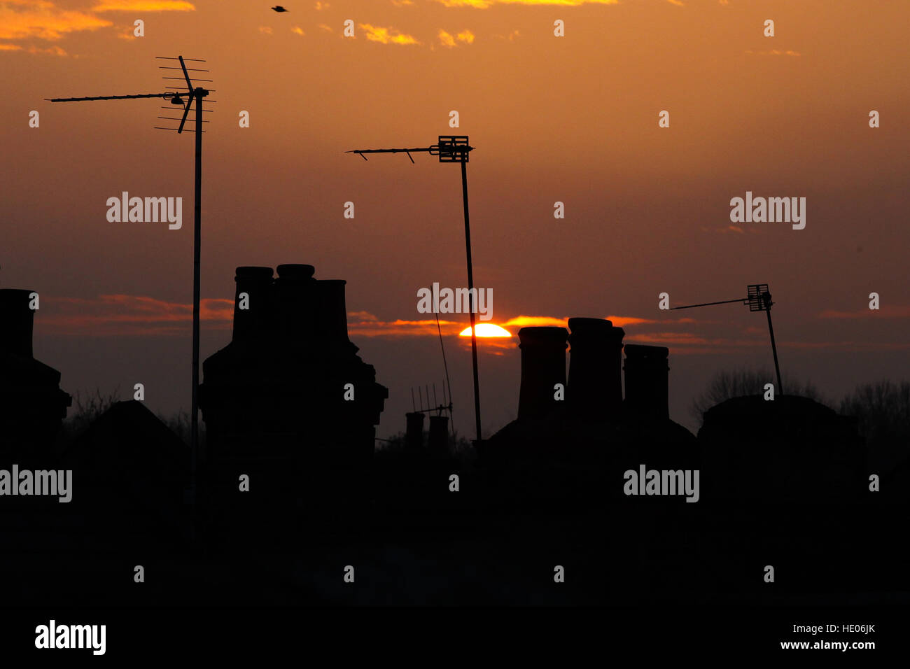 North London, UK. 16th Dec, 2016. Silhouette of chimneys during winter golden glow sunset over north London. © Dinendra Haria/Alamy Live News Stock Photo