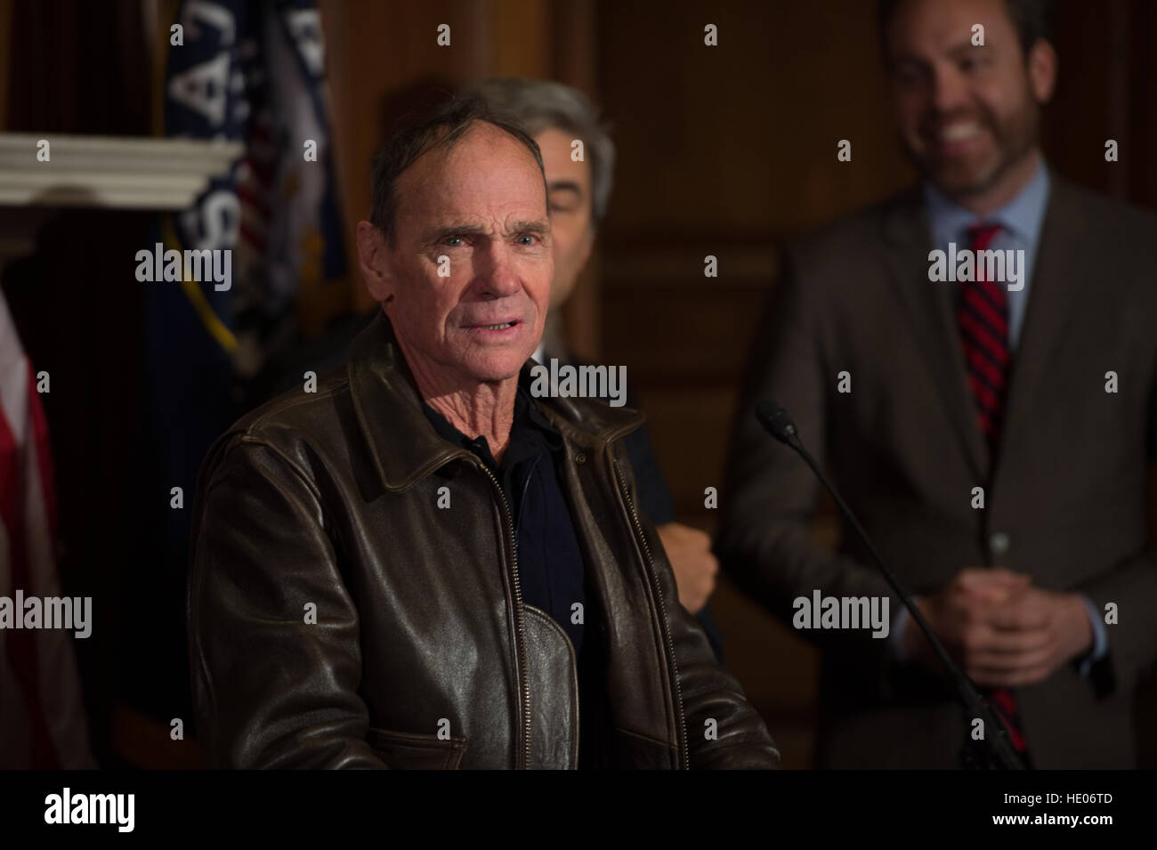 Washington, USA. 15th Dec, 2016. Contemporary artist Michael Heizer speaks during an easement signing ceremony in the U.S. Capitol December 15, 2016 in Washington, DC. The easement will help protect the Basin and Range National Monument in Nevada that contains the massive earthworks art project City by Heizer. © Planetpix/Alamy Live News Stock Photo