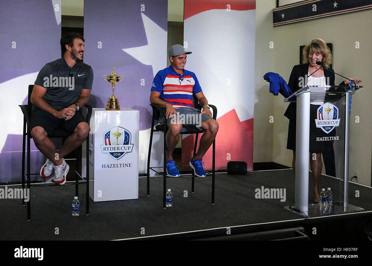 Palm Beach Gardens, Florida, USA. 18th Oct, 2016. U.S. Ryder Cup golfer BROOKS KOEPKA (L), a former Cardinal Newman grad, and his Ryder Cup teammate RICKIE FOWLER (C) listen as Cardinal Newman High School Principal Dr. Christine Higgins makes a presentation Tuesday, October 18, 2016 during a Trophy celebration at PGA Headquarters in Palm Beach Gardens. (Credit Image: © Allen Eyestone/The Palm Beach Post via ZUMA Press) Stock Photo