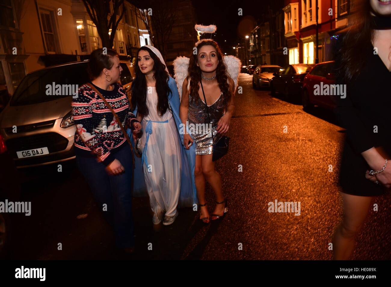 Aberystwyth, Wales, UK. 16th December 2016.     People out in Aberystwyth on ‘Booze Black Friday' or ‘Mad Friday', the last working Friday before Christmas when workers celebrate with their colleagues .   Alcohol sales in pubs, clubs and off-licences rise dramatically on this day   Photo © Keith Morris/Alamy Live News Stock Photo