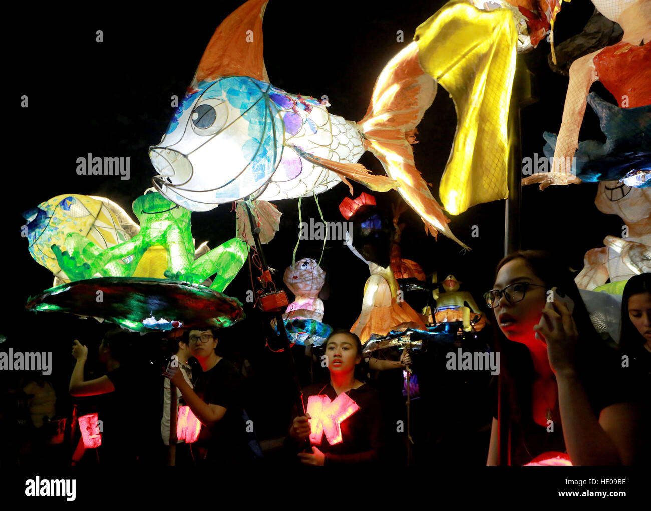 Quezon City, Philippines. 16th Dec, 2016. Students march with colorful lanterns during the annual Lantern Parade at the University of the Philippines in Quezon City, the Philippines, Dec. 16, 2016. The annual Lantern Parade showcases colorful floats, lanterns, street performances, various costumes and spectacular fireworks in celebration of the start of the Christmas break for students. © Rouelle Umali/Xinhua/Alamy Live News Stock Photo