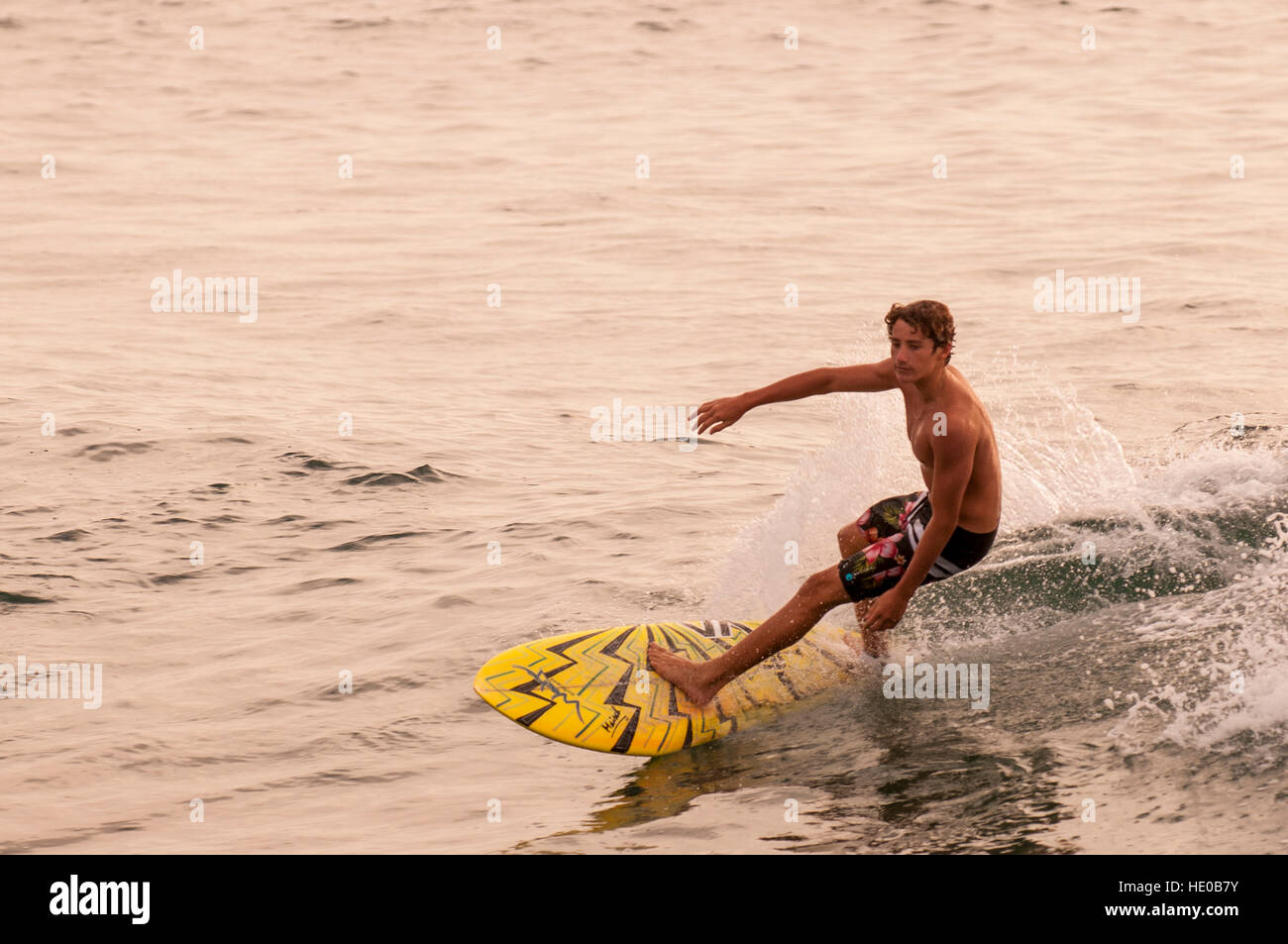 Surfing in Turtle Bay, North Shore, Oahu, Hawaii. Stock Photo