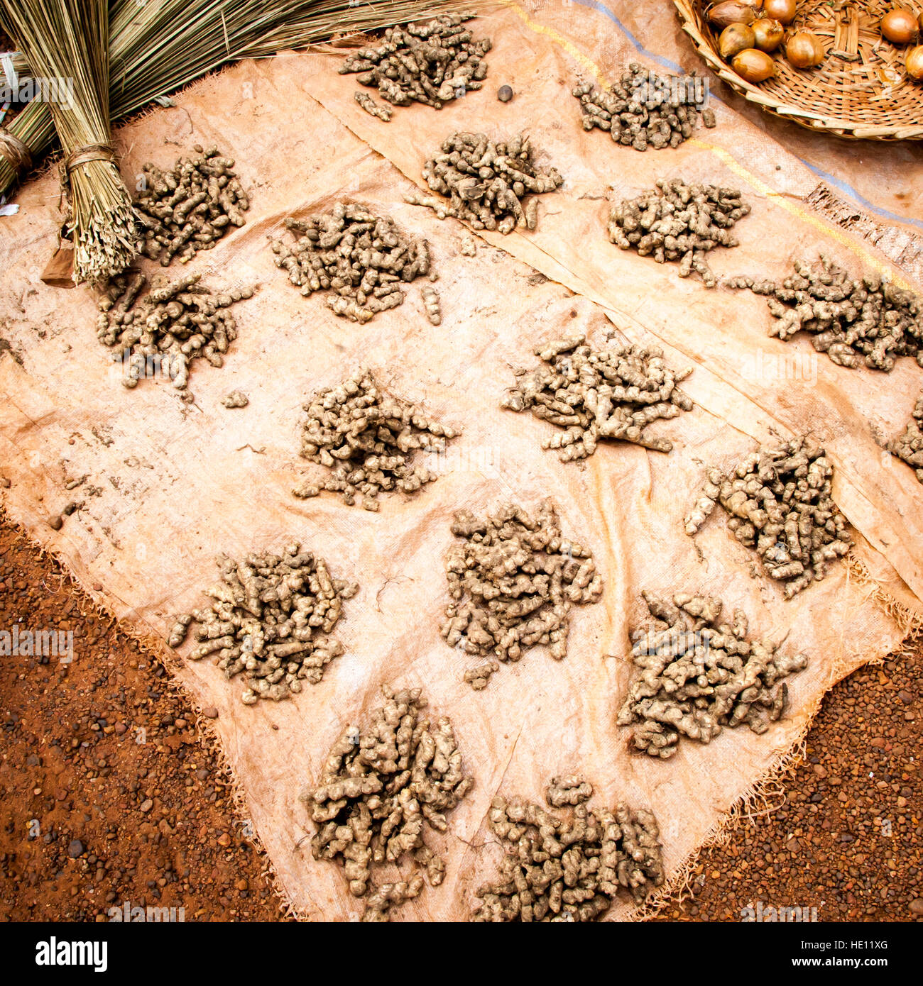 Piles of turmeric on market in Sierra Leone Stock Photo