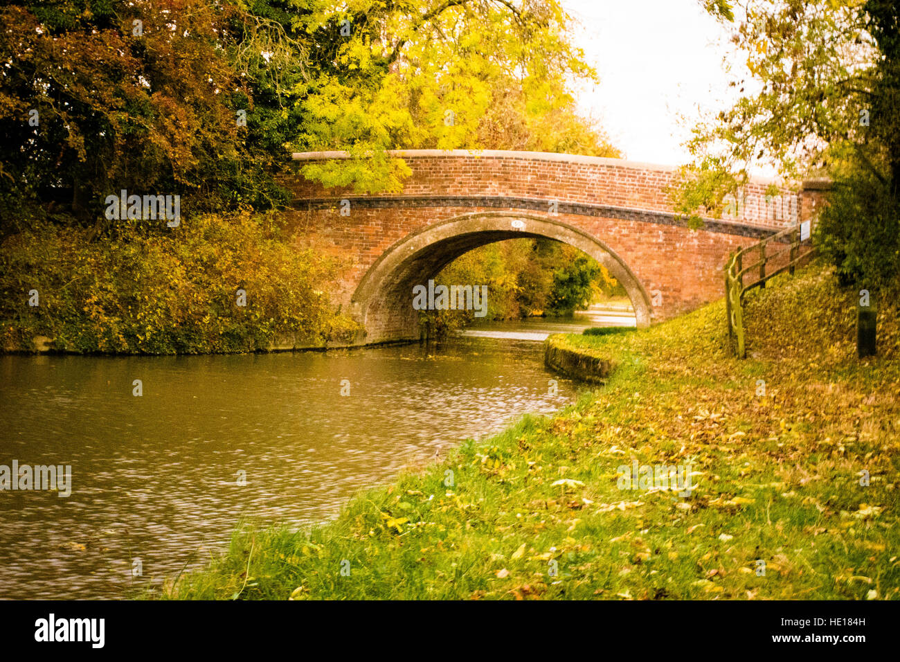 a canal bridge with beautiful autumn leaves Stock Photo