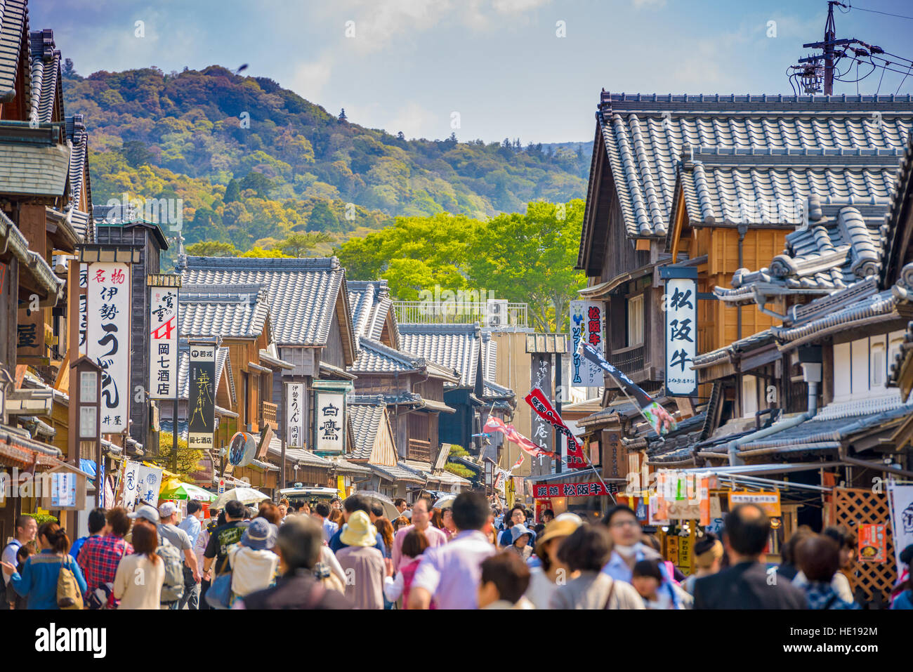 ISE, JAPAN - APRIL 25, 2014: Crowds walk on the historic shopping street of Oharai-machi. The reconstructed buildings are completed in the Edo period  Stock Photo
