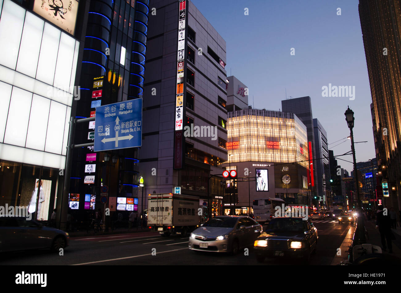 Cityscape and japanese people drive car on traffic road in dusk time at Shinjuku city of Kanto region on October 20, 2016 in Tokyo, Japan Stock Photo