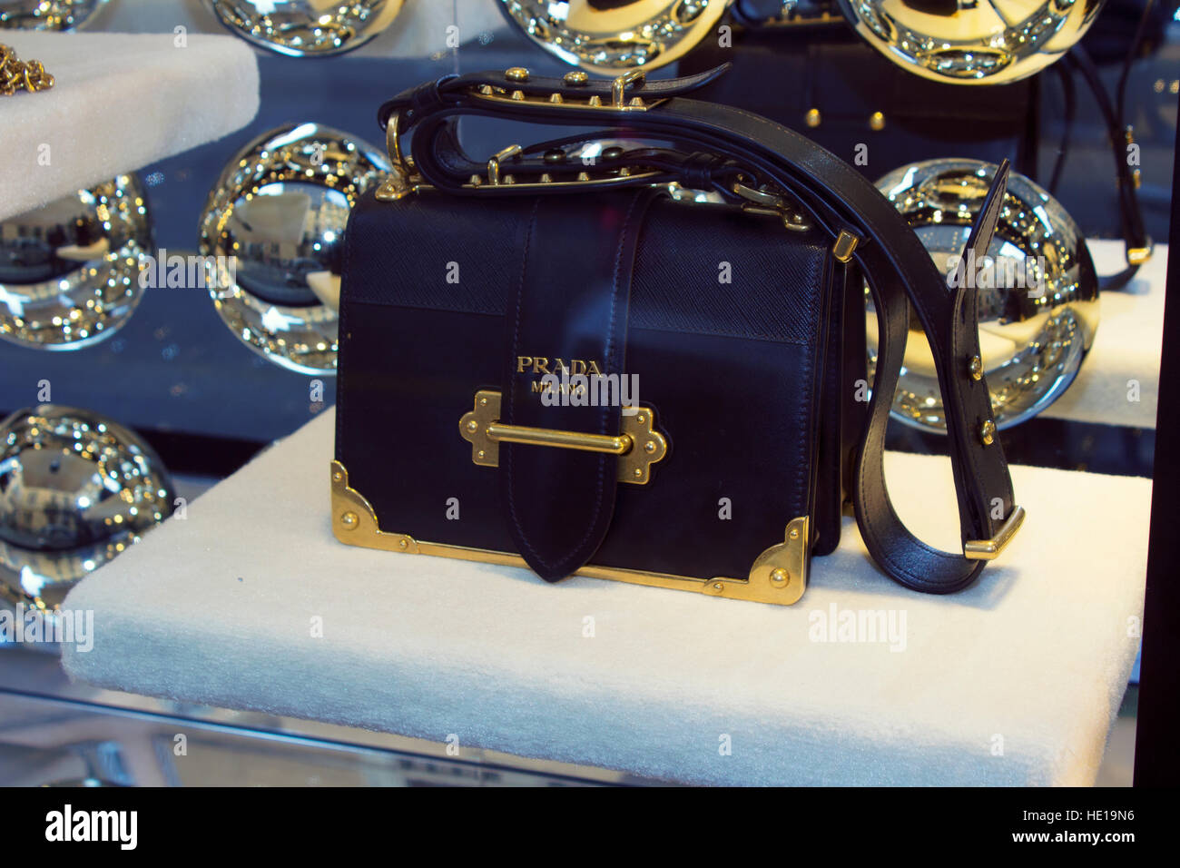 Haute couture accessory fashion window: Prada woman leather bags and  elegant decolte shoes, with gold details and chain Stock Photo - Alamy