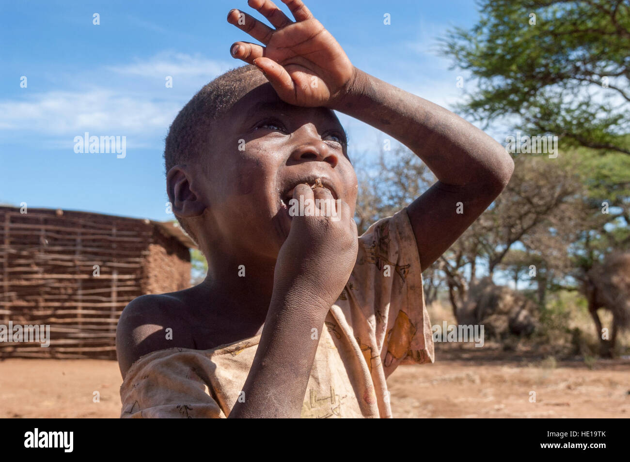 A child of the Hadza tribe looking up into the sky, Yaeda valley ...