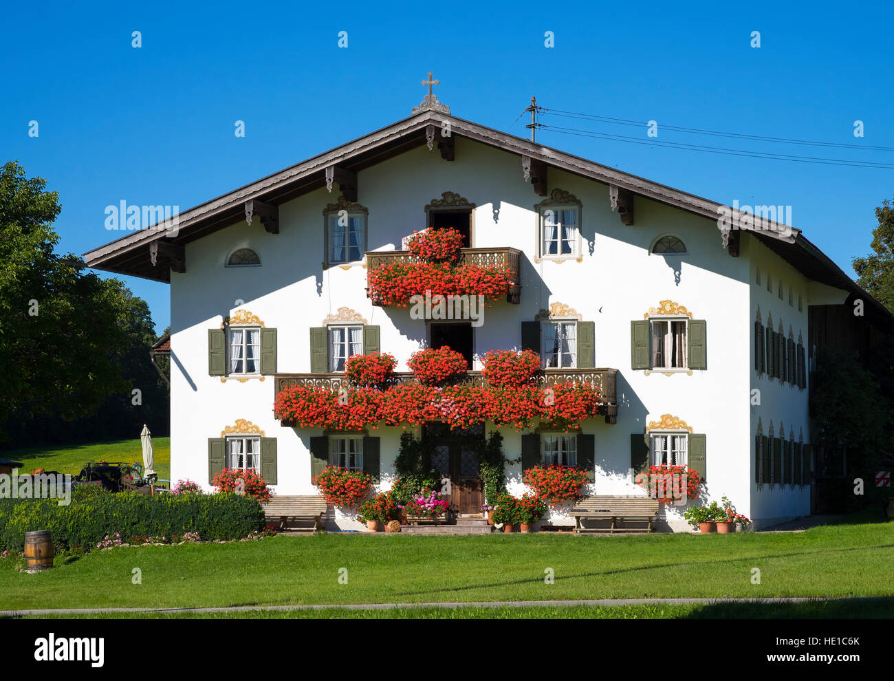 Farmhouse with balcony flowers, Schweinthal bei Miesbach, Bayerisches Oberland, Upper Bavaria, Bavaria, Germany Stock Photo