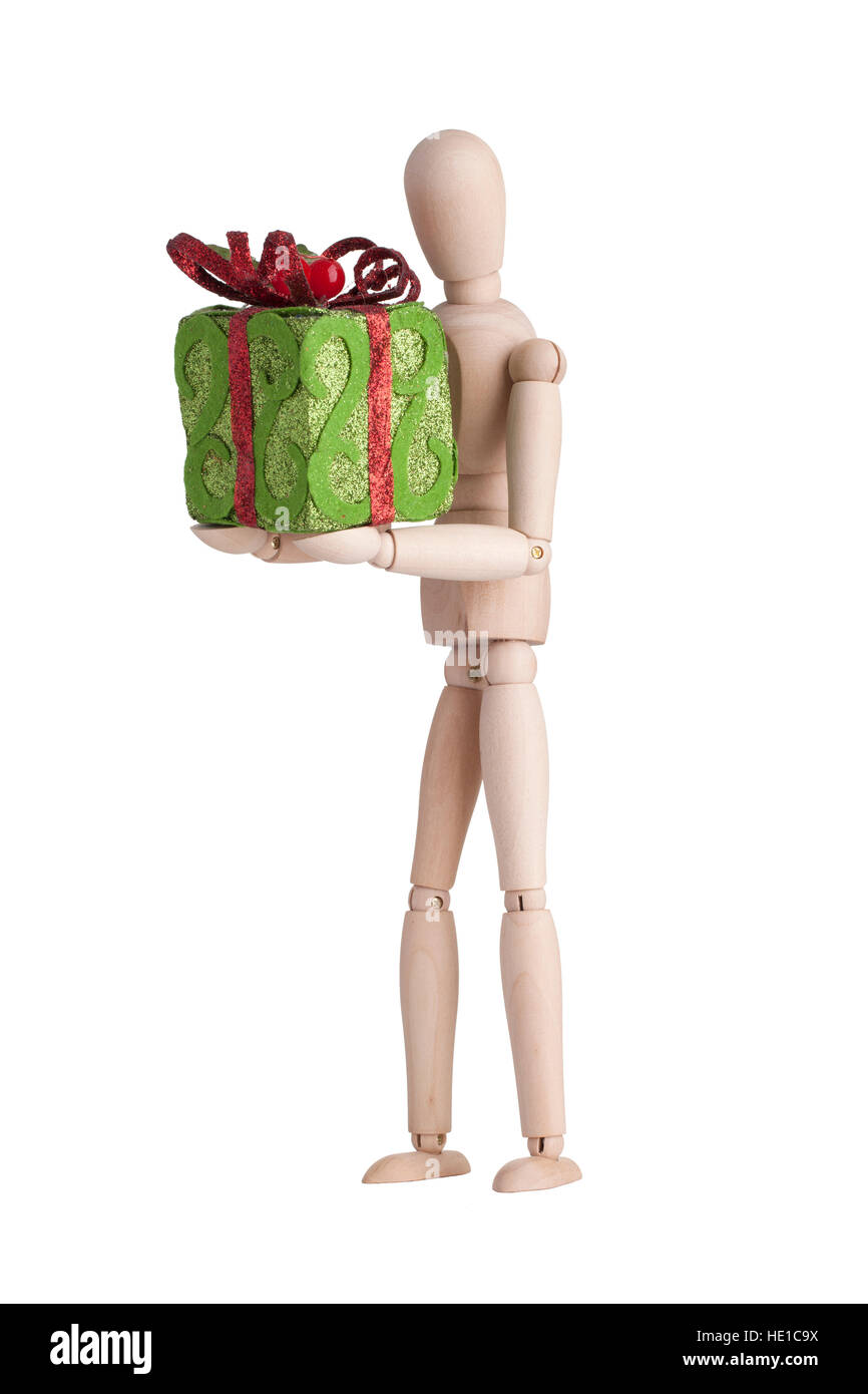 Wooden mannequin with xmas gift Stock Photo