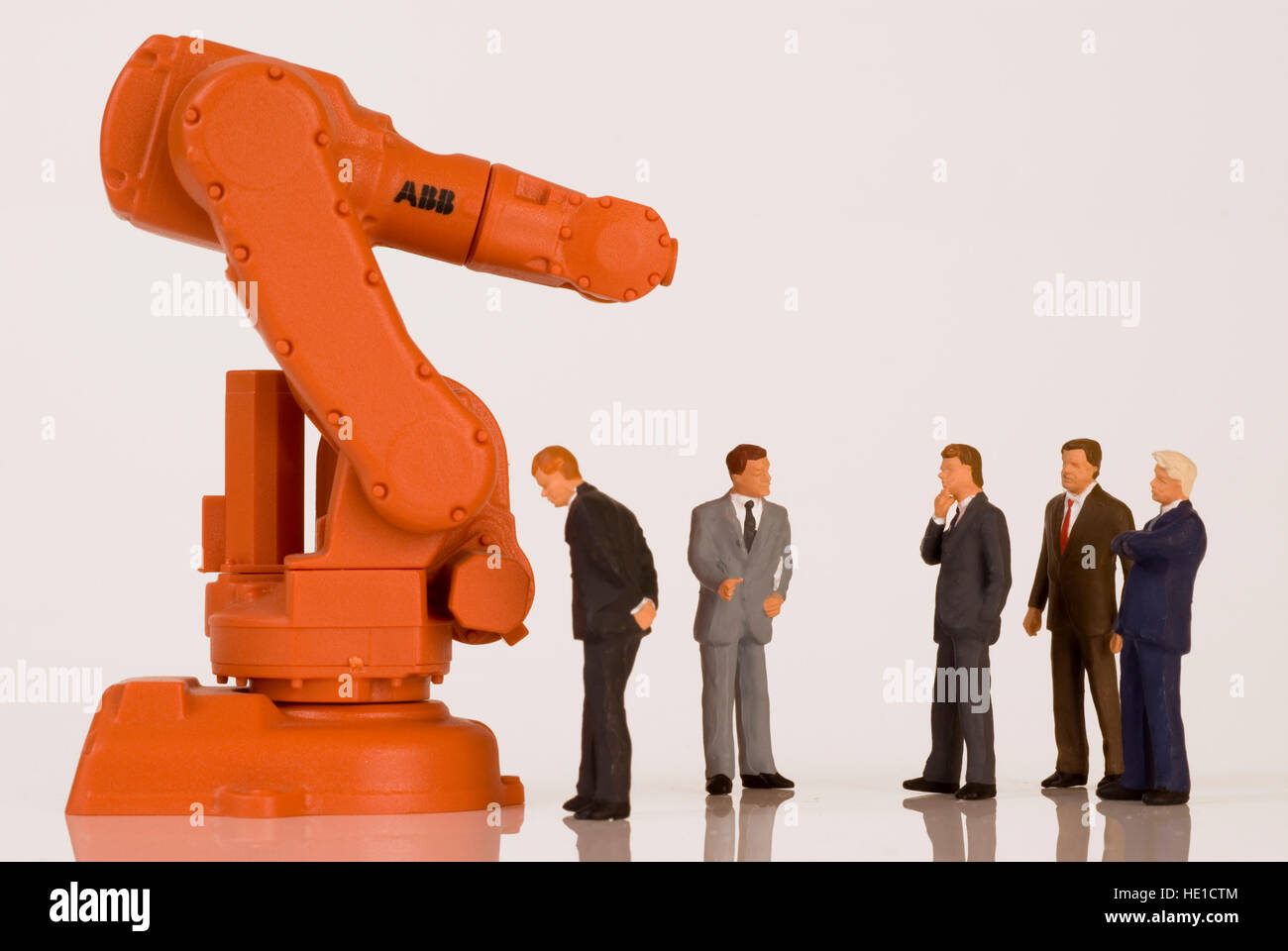 Industrial robot and business executives Stock Photo