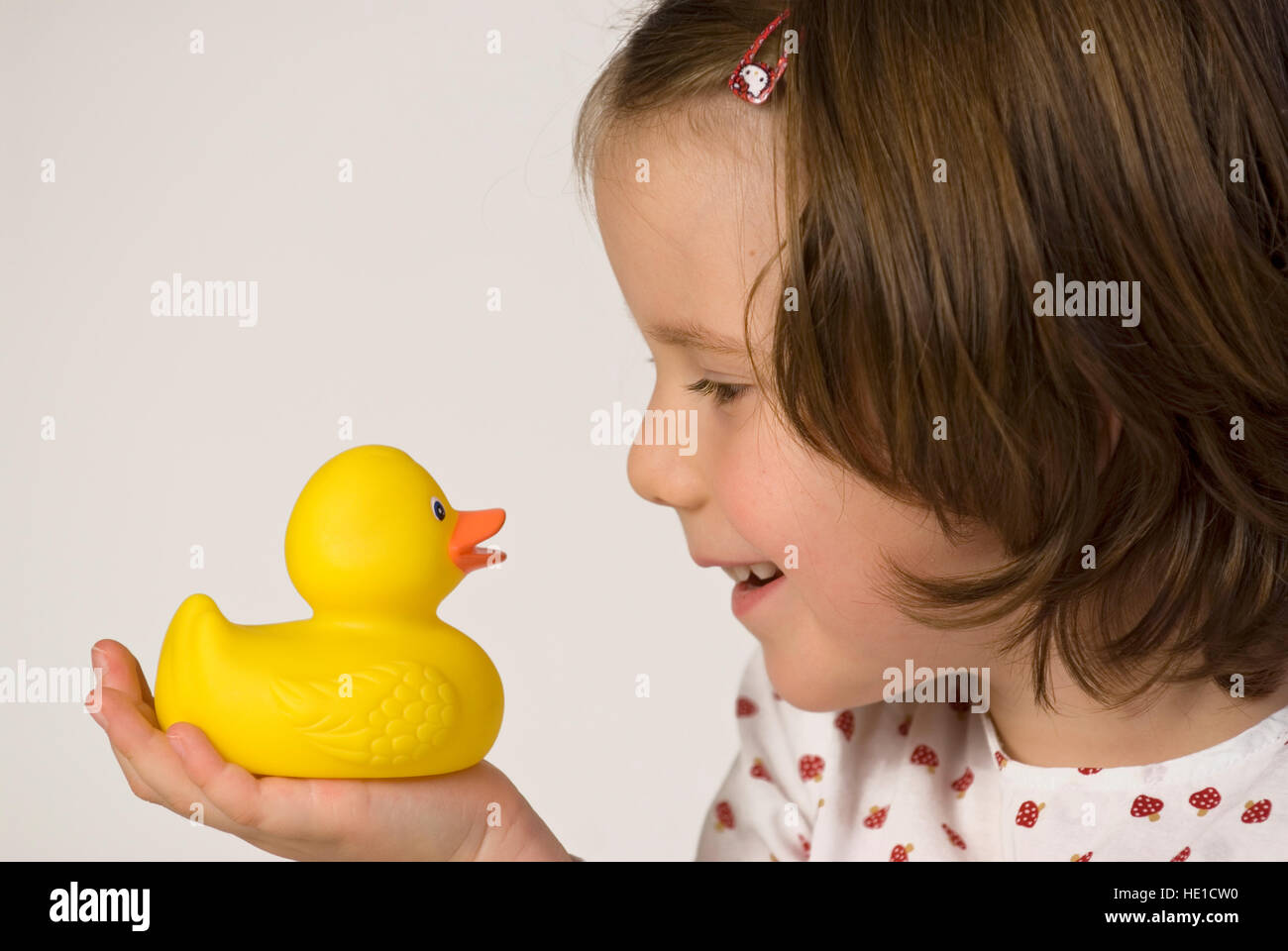 Girl holding a rubber duck Stock Photo