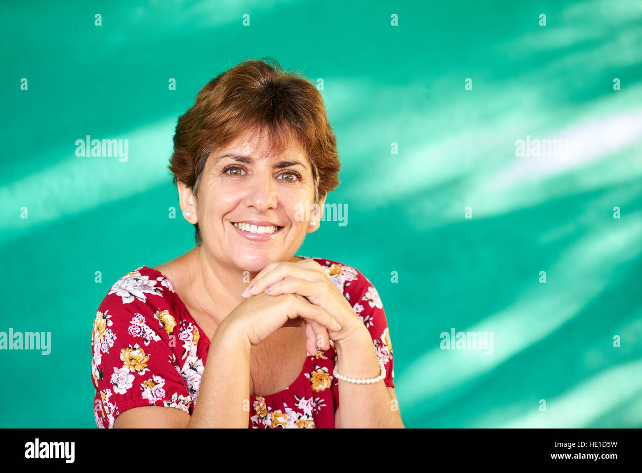Cuban people and emotions, portrait of latina lady laughing and looking at camera. Happy hispanic woman from Havana, Cuba smiling Stock Photo