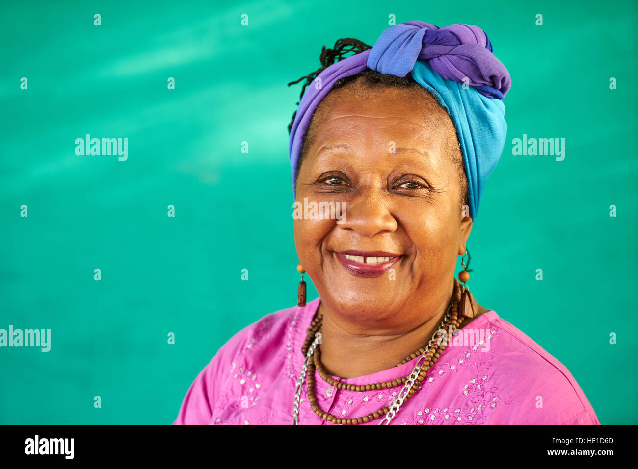 Old Cuban people and emotions, portrait of senior african american lady laughing and looking at camera. Happy elderly black woman from Havana, Cuba sm Stock Photo