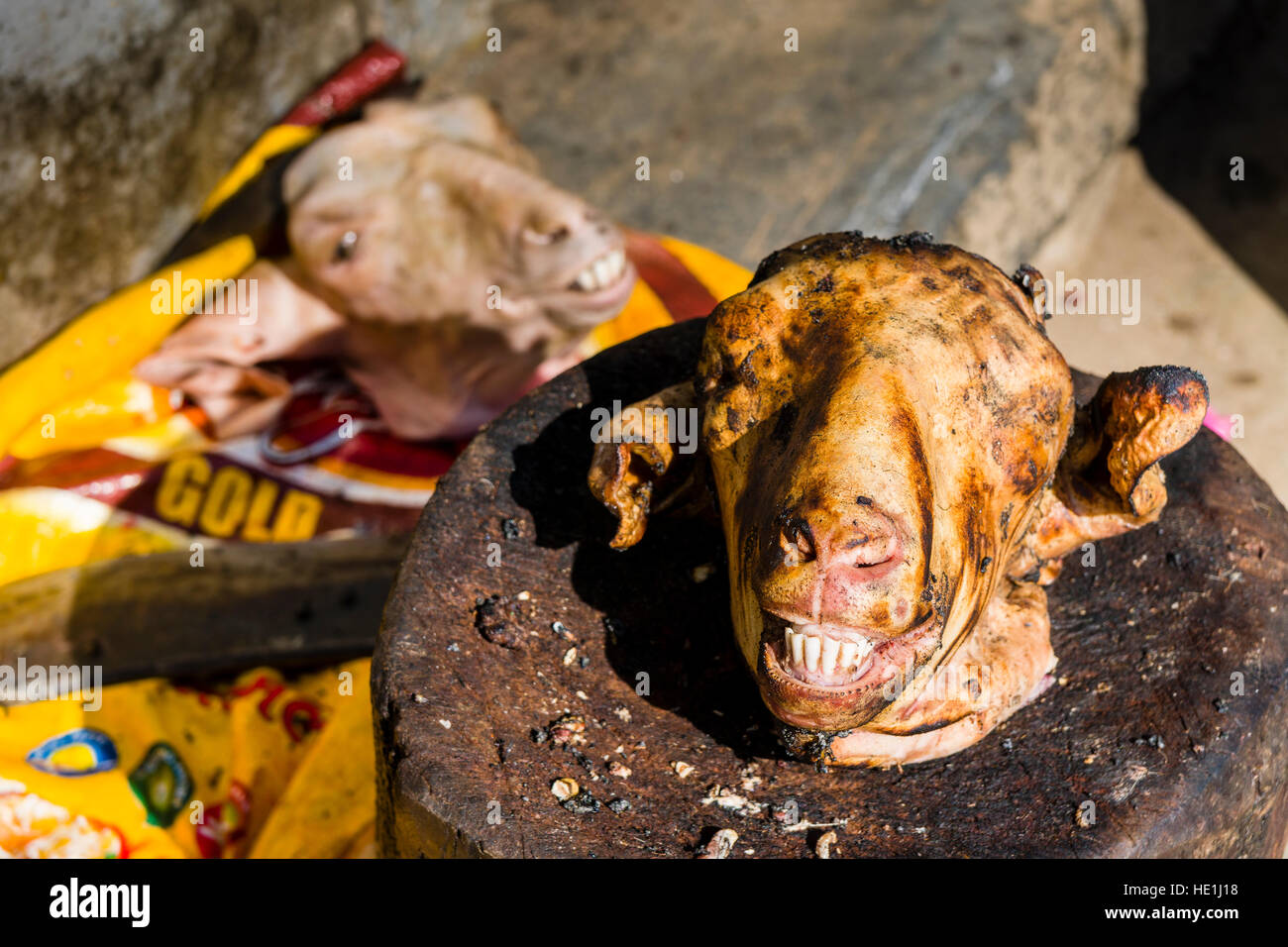 A goat head is offered for sale outside a meat shop Stock Photo