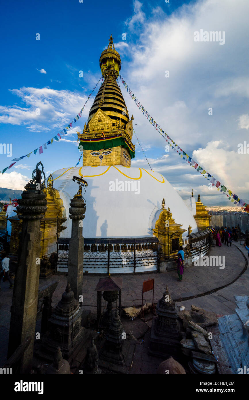 The white stupa of Swayambhunath temple, Monkey Temple, is decorated with tibetan prayer flags Stock Photo
