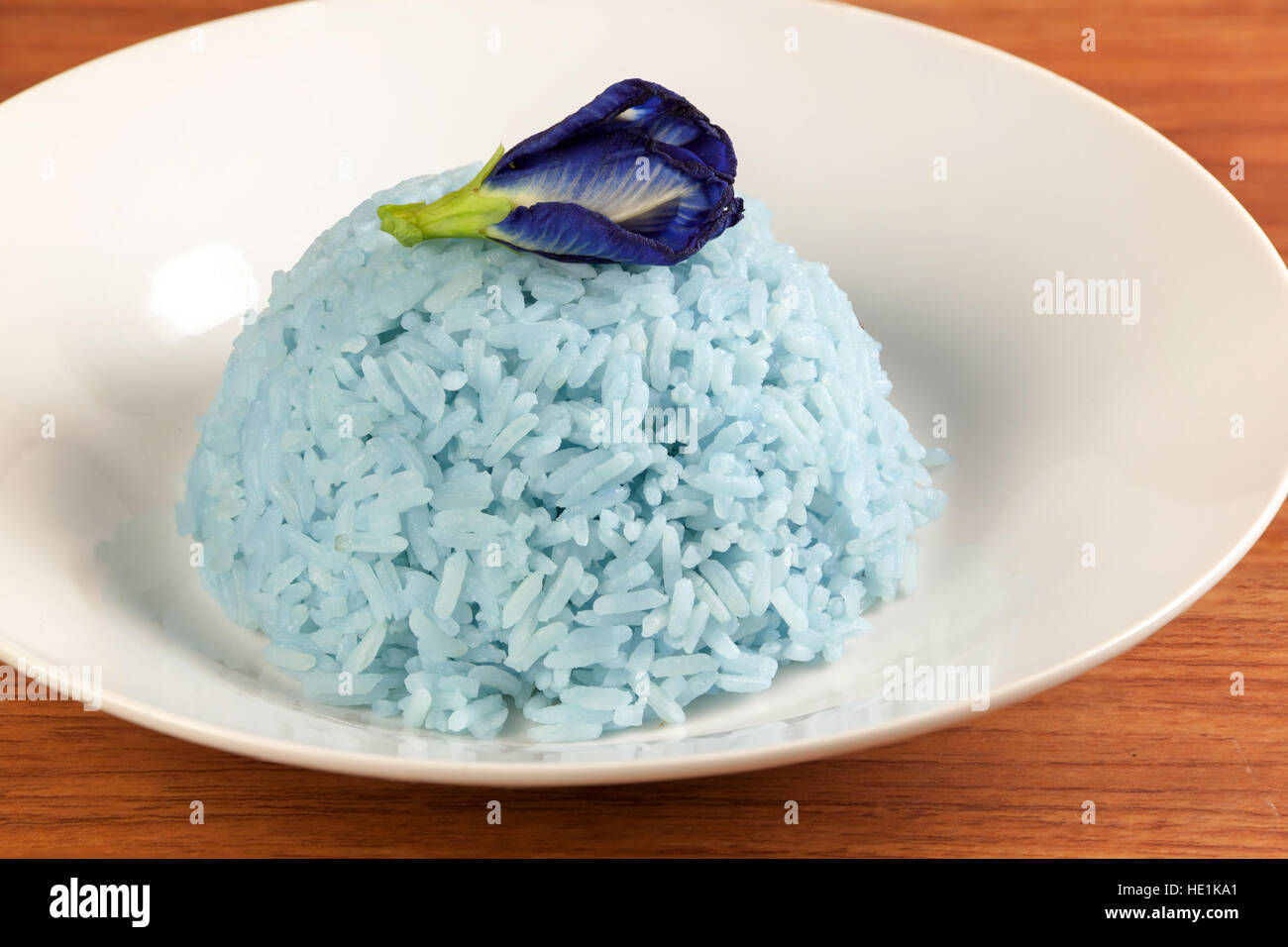 Blue Rice made cooking from Butterfly Pea flower (Clitoria ternatea L) in white dish. Rice has a