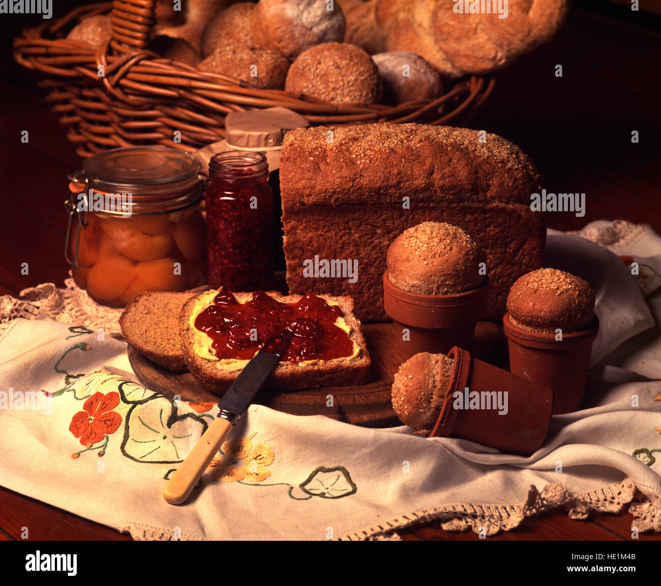 Still life of bread, butter and jam. Stock Photo