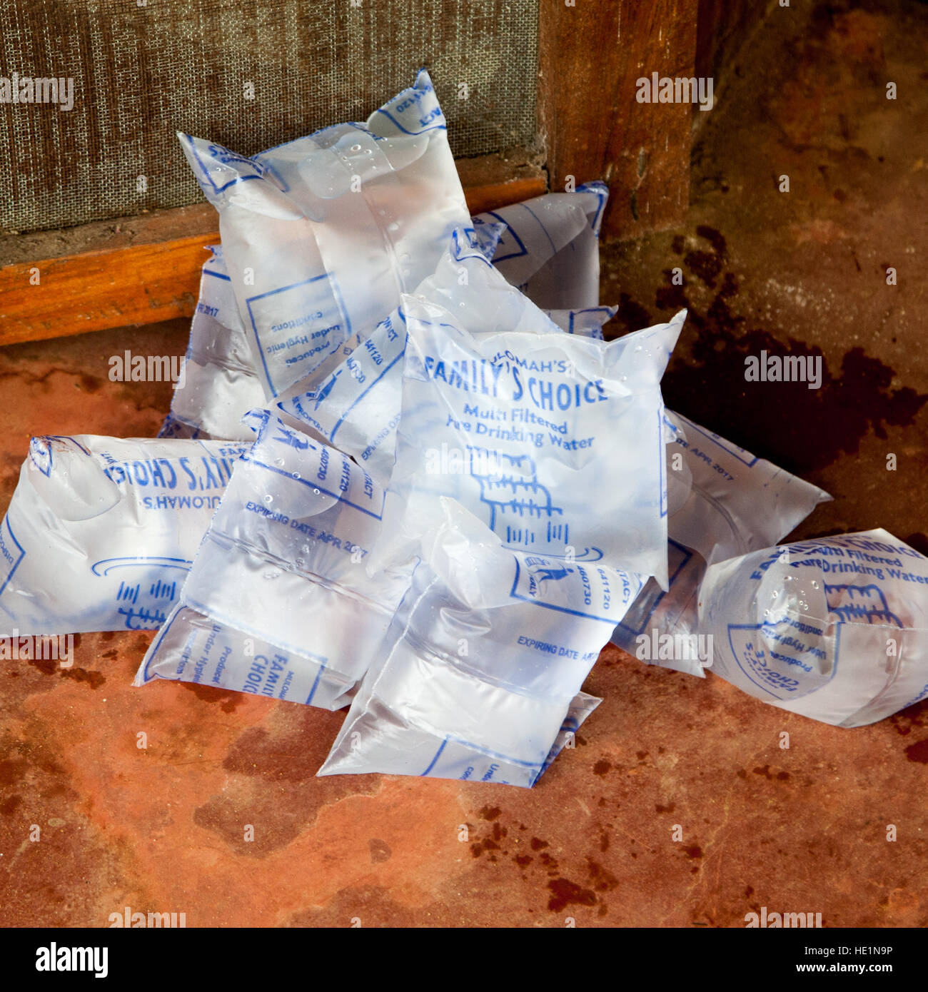 Portions of drinking water. Clean drinking water is sold in plastic bags in Sierra Leone. You bite off a corner and with a little practice you can drink without getting wet Stock Photo