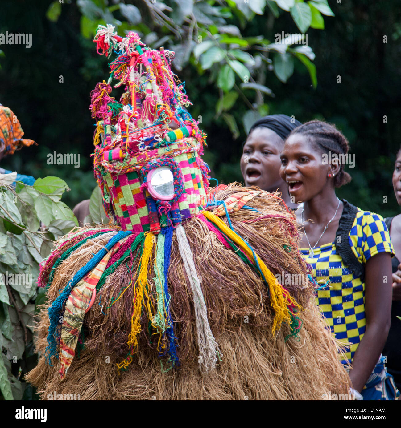 Mende people dance with gbeni mask in Gola Rain Forest Stock Photo