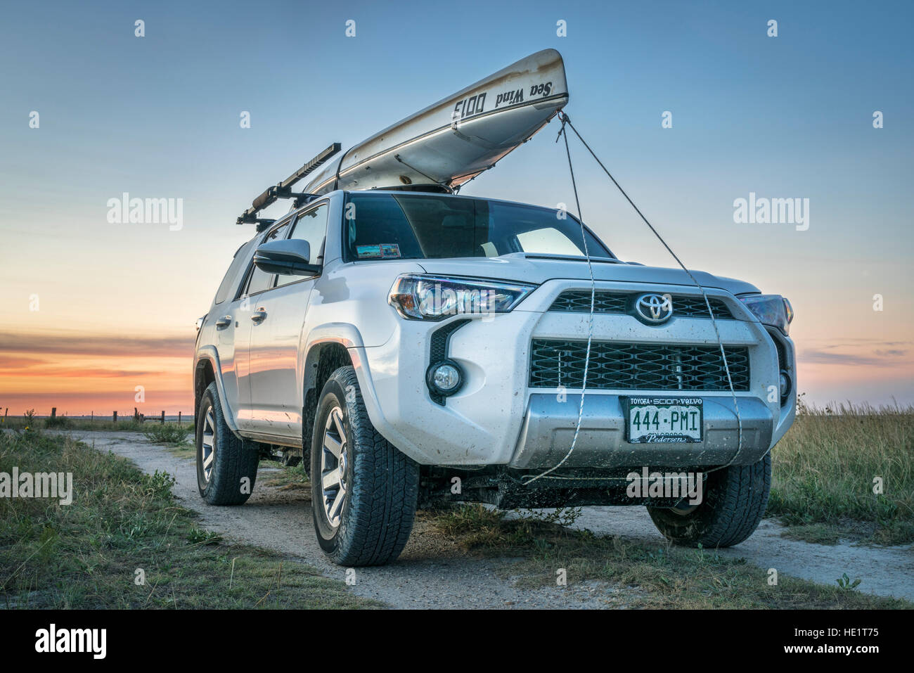 CASTLE ROCK KS USA JULY 25 2016 Toyota 4Runner SUV 2016 Trail edition with a canoe Sea Wind by Kruger Canoes on roof racks driving during su Stock Photo Alamy