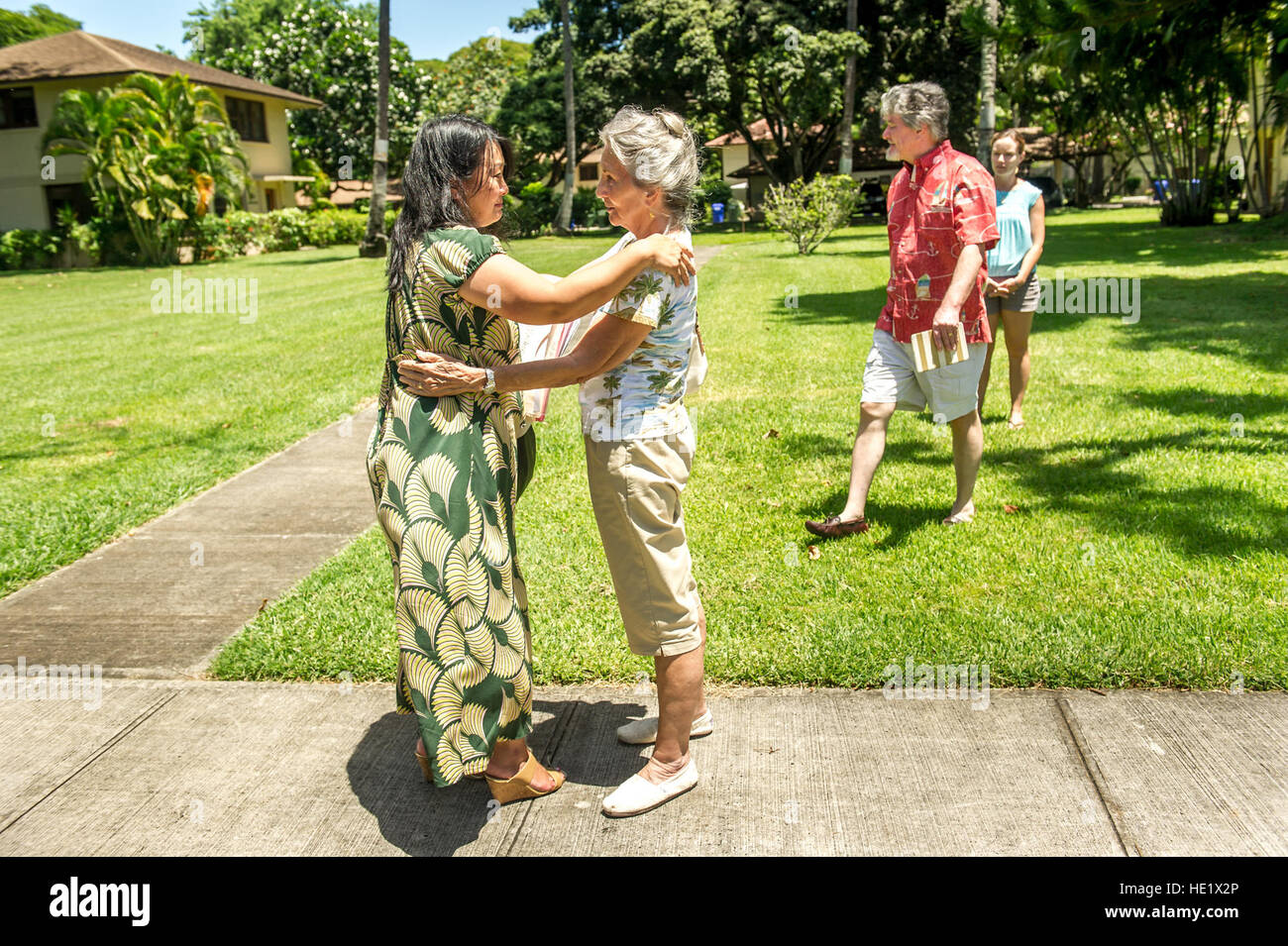 Shirley Waldron Nied, foreground right, talks with 15th Wing volunteer historian Jessie Higa, at Hickam Field at Joint Base Pearl Harbor Hickam on Aug 8, 2016, outside the home where, a then five-year-old, Neid lived in during the Japanese attack on Hickam Field and Pearl Harbor on Dec 7, 1941.  J.M. Eddins Jr. Stock Photo
