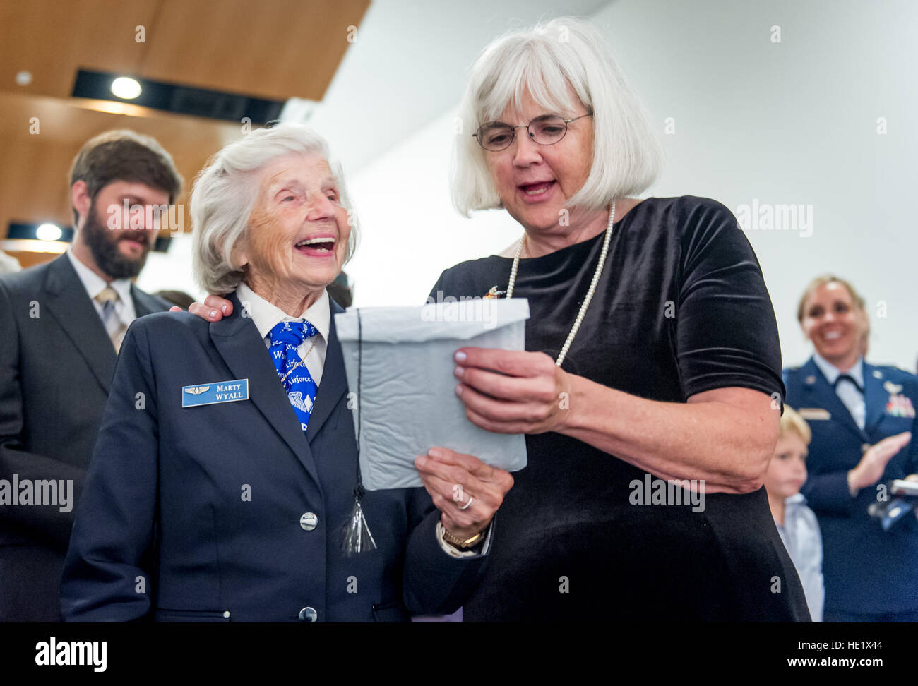 Terry Lee Harmon, daughter of Elaine Danforth Harmon, who served as a Women Airforce Service Pilot WASP during World War II, sings the U.S. Air Force song with former WASP, Mary Anna 'Marty' Martin Wyall, 95, at a memorial service held at the Women in Military Service for America Memorial, after a funeral service, with full military honors, for Harmon at Arlington National Cemetery, Sept. 7, 2016. Harmon's family worked since her death in April of 2015, at 95 years old, to reverse a U.S. Army decision, that same year, to revoke the eligibility for WASPs for interment at Arlington. The WASPs, a Stock Photo