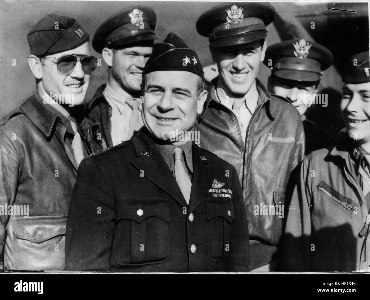 Lt. Gen. James H. Doolittle center, commander of the Army Air Forces  Eighth Air Force, is surrounded by a group of U.S. flyers. This picture was taken before his promotion to lieutenant general.  The general took part in the first raid on Tokyo on April 18,1942, when a squadron of B-25 bombers, not designed for carrier operations, took off from the USS Hornet in the North Pacific Ocean to bomb military installations in Japan. Stock Photo