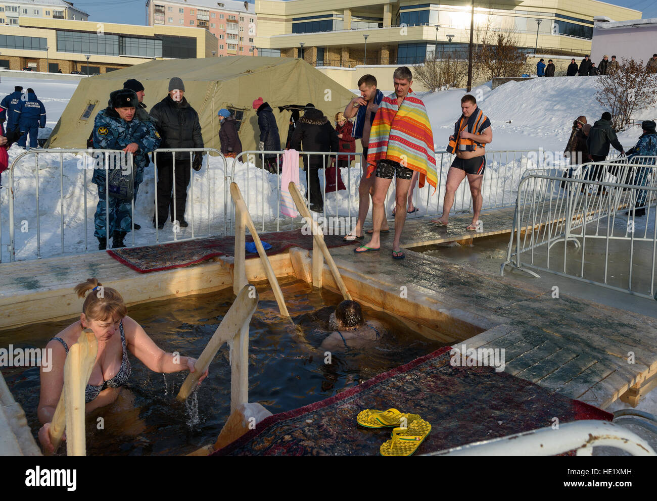 People bathe into cold water of icehole on Epiphany day. Traditional