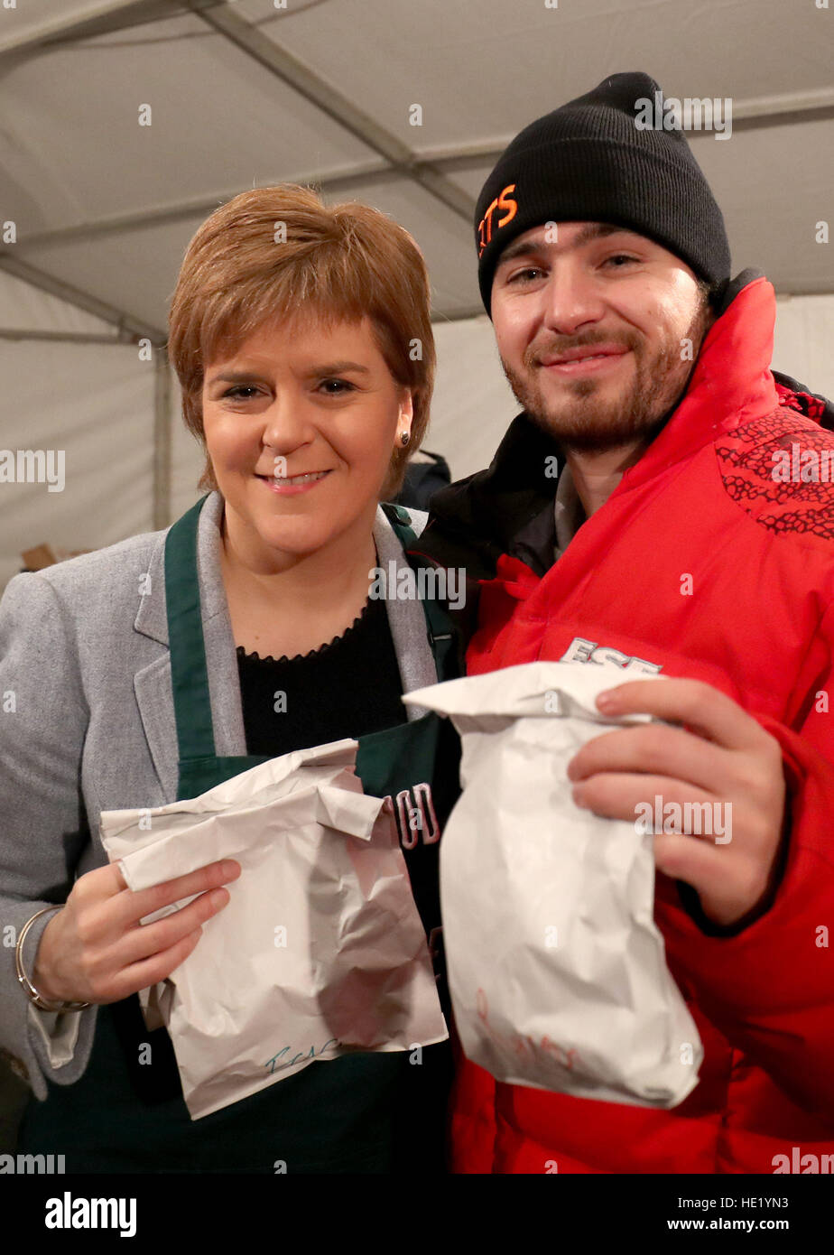 First Minister Nicola Sturgeon with Josh Littlejohn, founder of Social Bite, as she helps serves breakfast in Charlotte Square, Edinburgh for participants in the first Social Bite CEO Sleepout, which saw some of Scotland's most wealthy and influential people in a sleepout to raise money for a new village for the homeless. Stock Photo