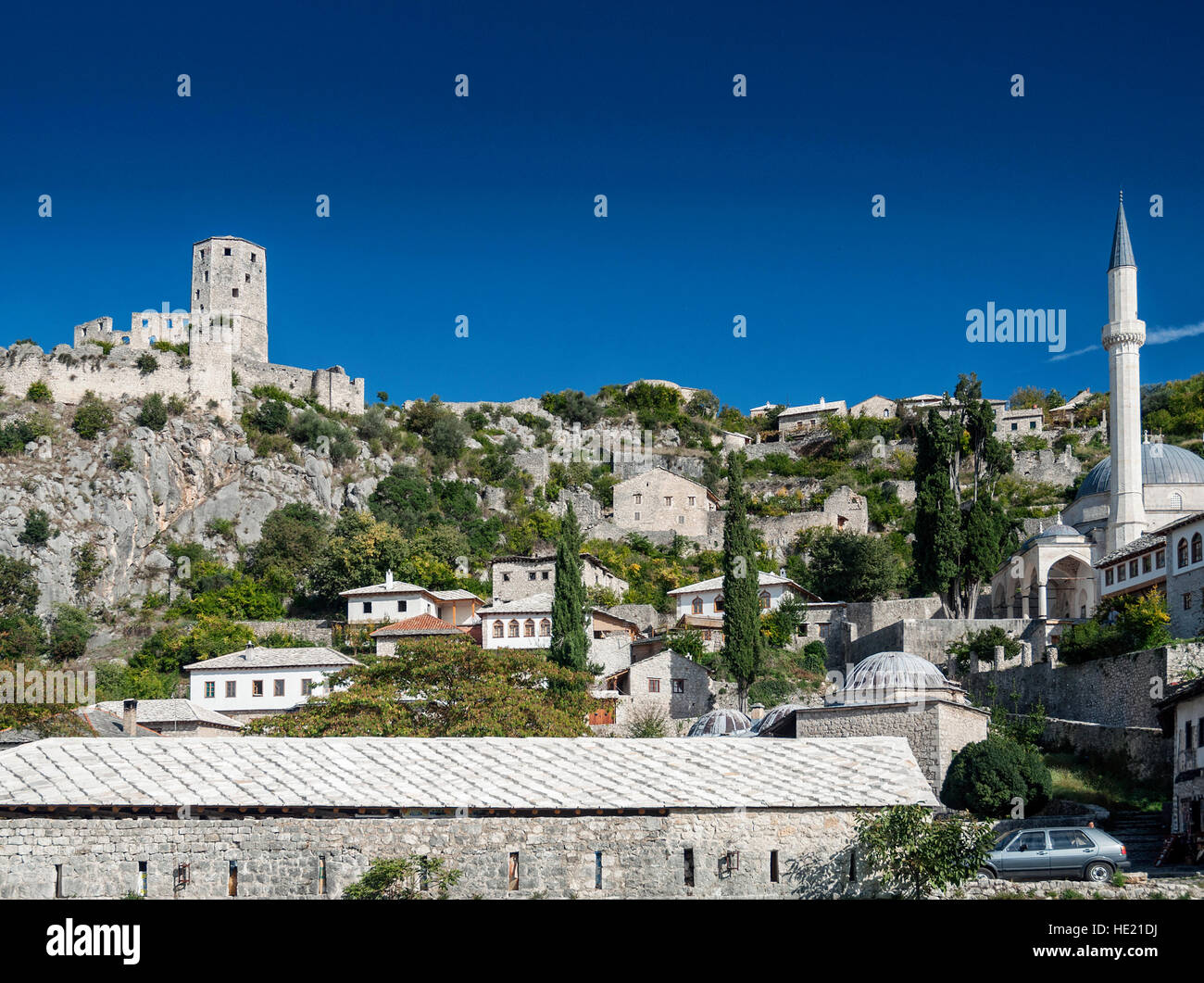 scenic view of pocitelj village traditional old architecture buildings and mosque in Bosnia Herzegovina Stock Photo