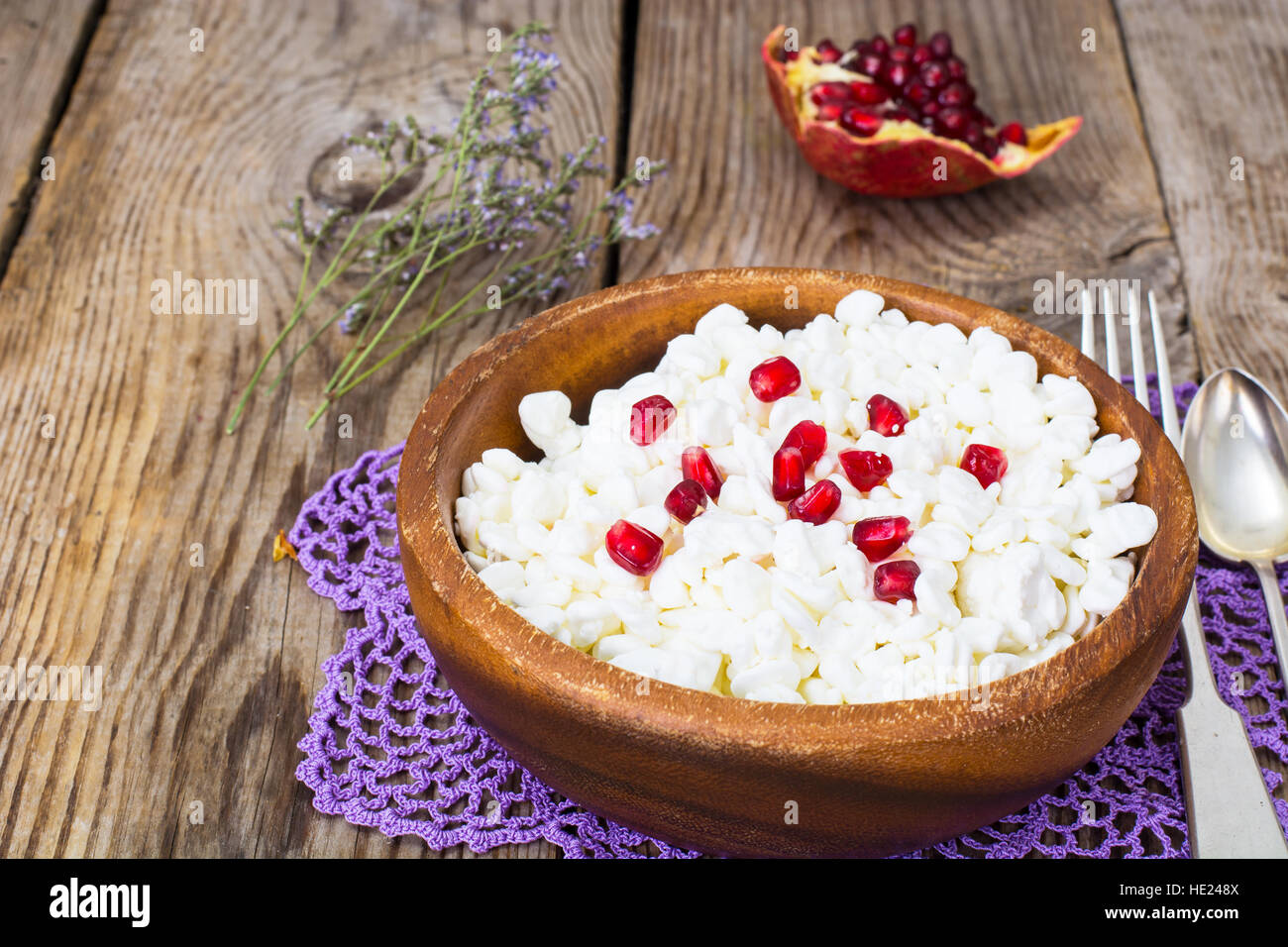 Healthy food. Cottage cheese with pomegranate seeds. Studio Photo Stock