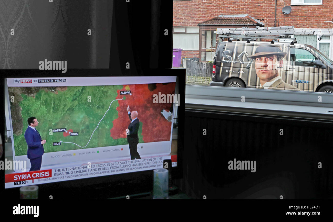 A Sky television engineer installs a satellite dish at an address in