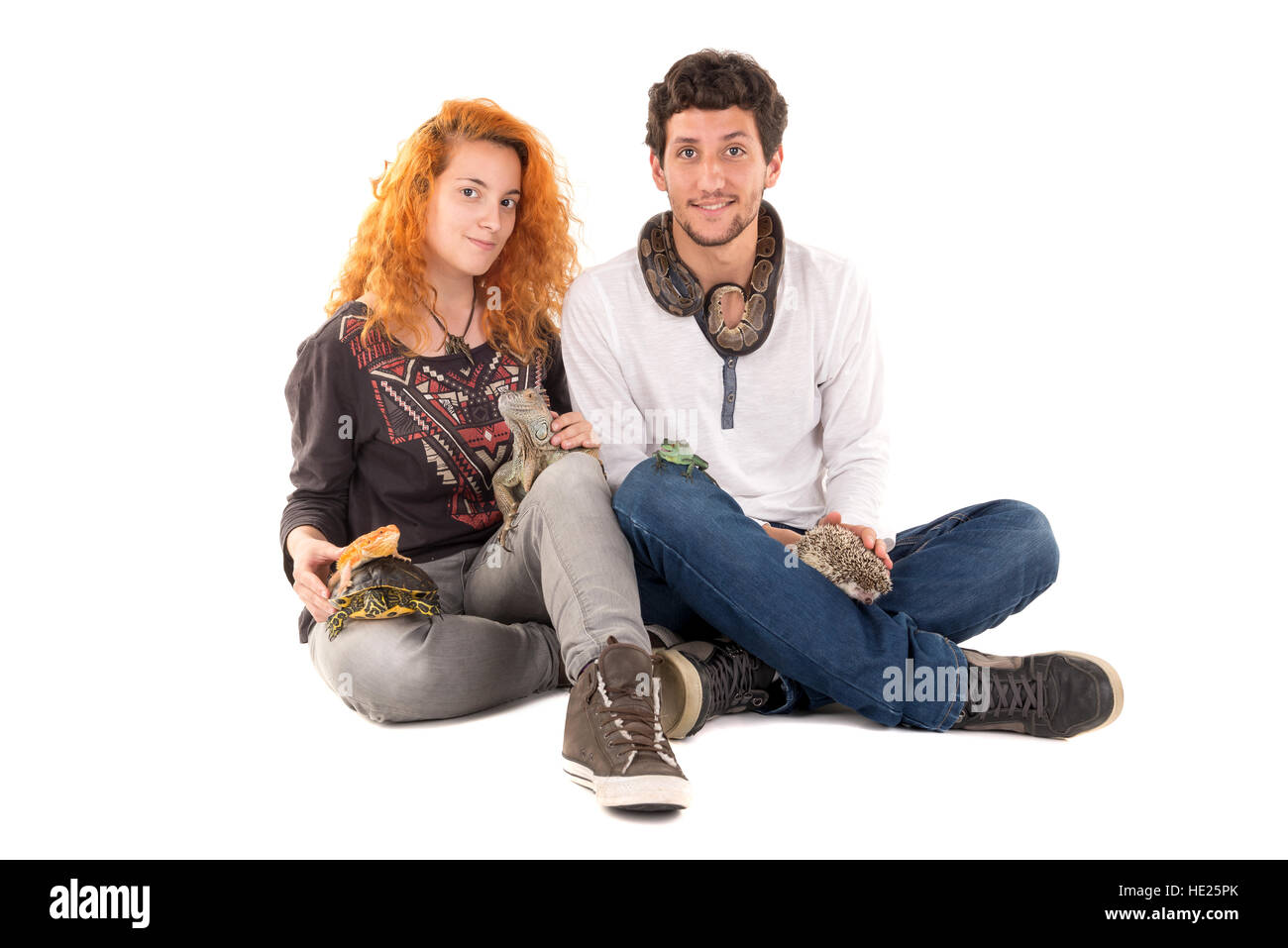 Couple with several pet animals isolated in white Stock Photo