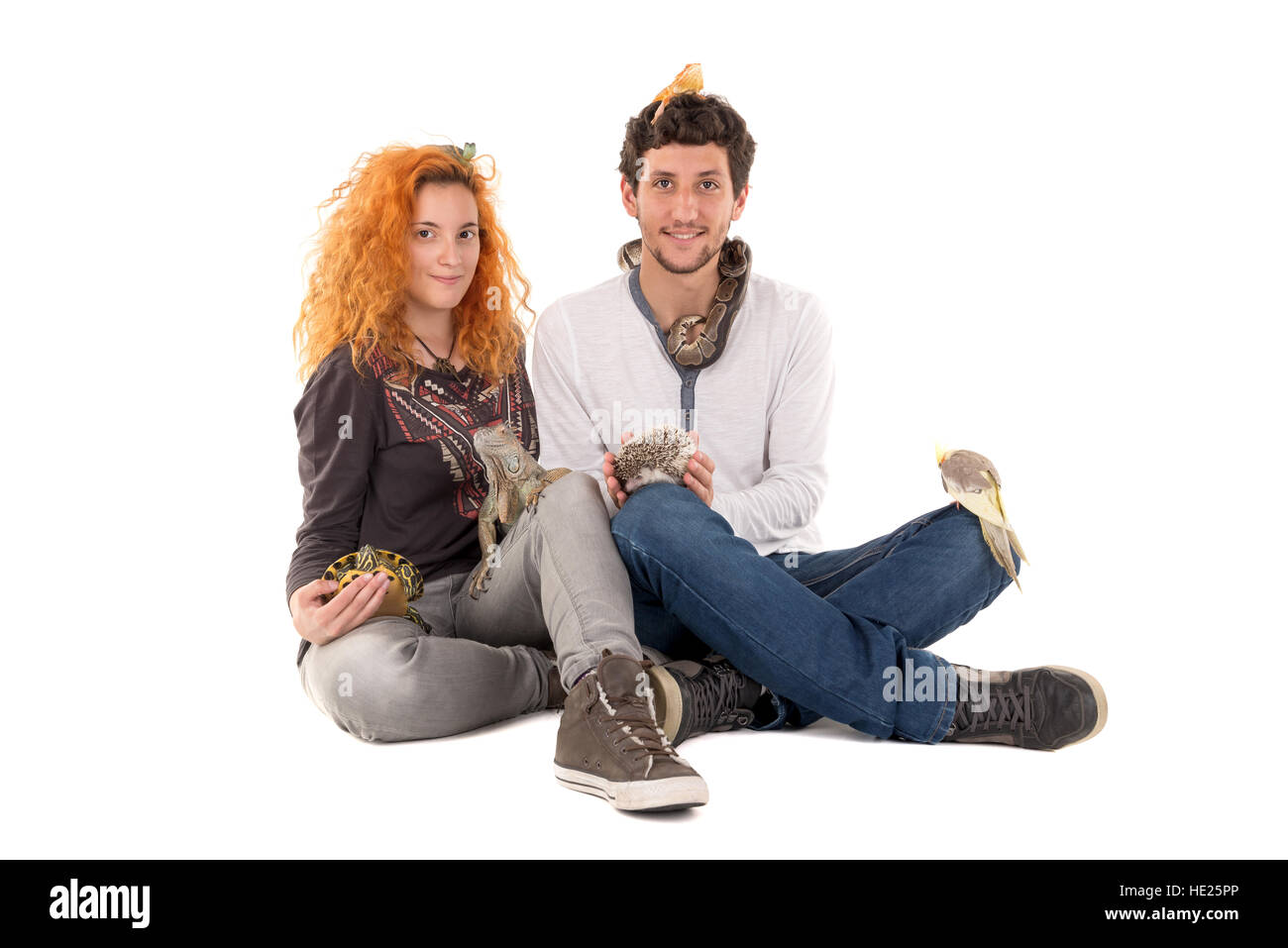 Couple with several pet animals isolated in white Stock Photo
